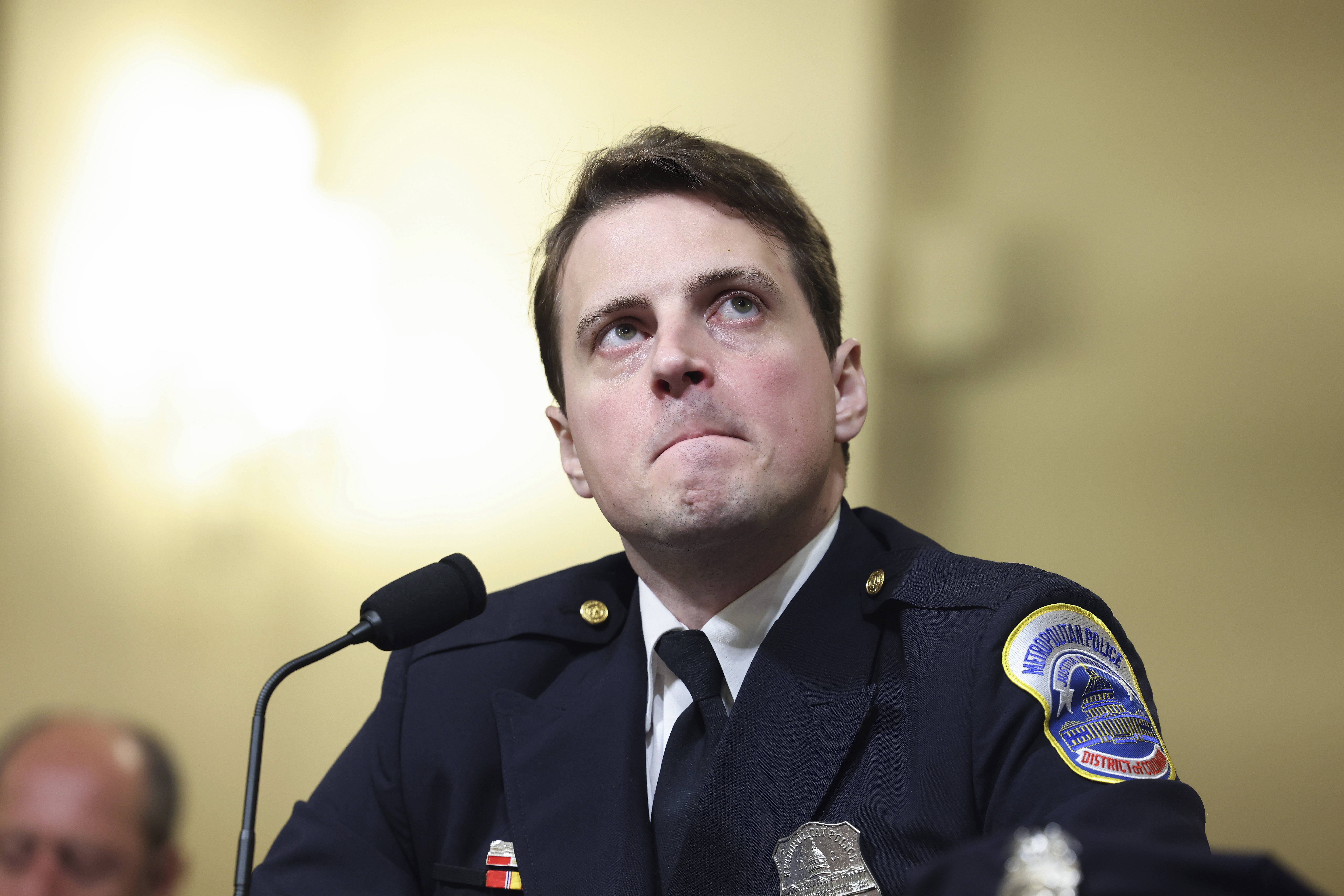 Washington Metropolitan Police Department Officer Daniel Hodges watches footage from his body camera during the House select committee hearing on Tuesday, July 27.