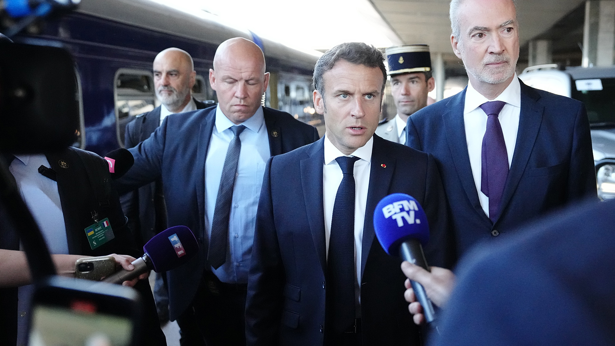 President of France Emmanuel Macron, center, speaks to the media upon arrival at the train station in Kyiv, Ukraine, on June 16.