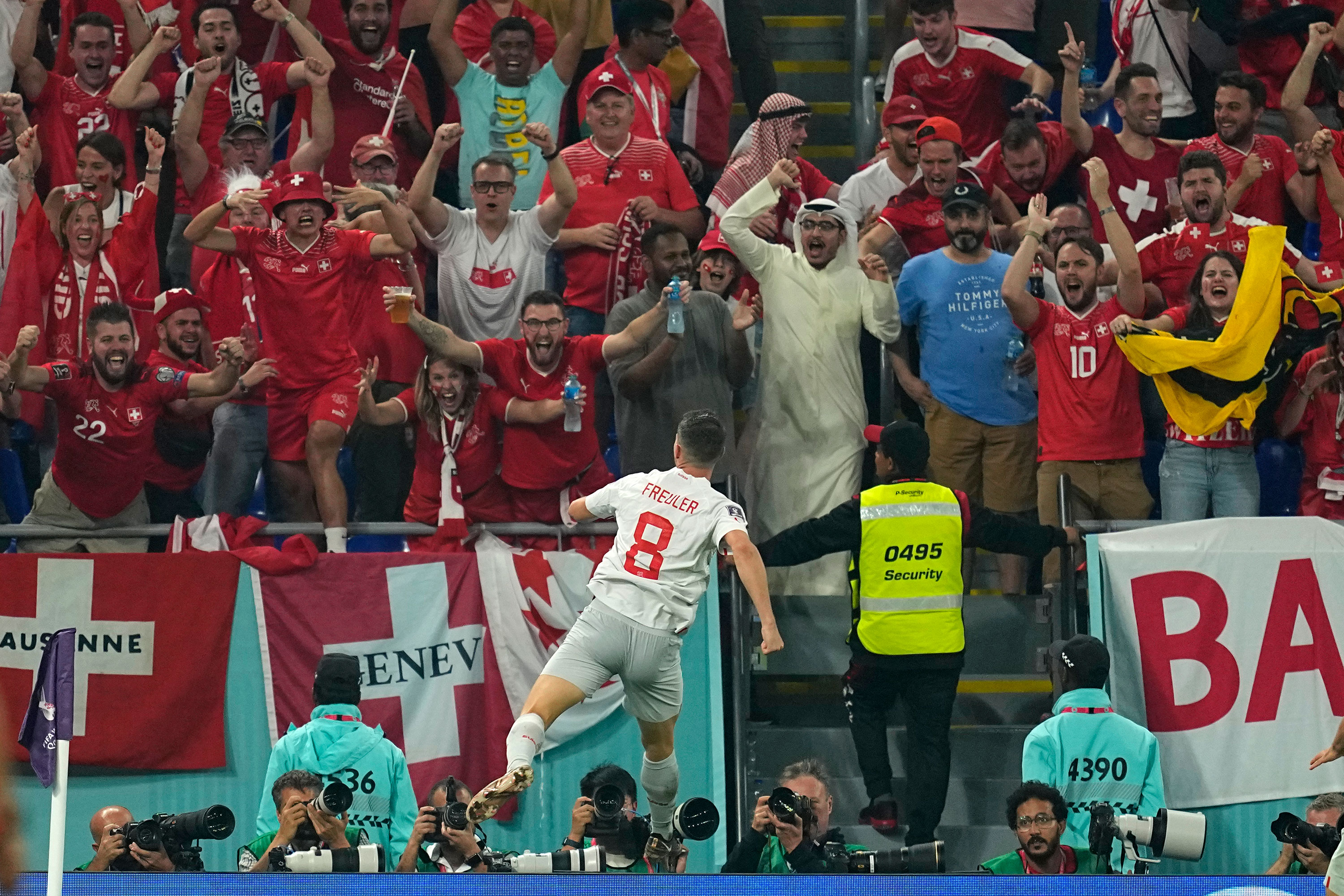 Switzerland's Remo Freuler celebrates in front of Switzerland supporters after scoring his team's third goal.