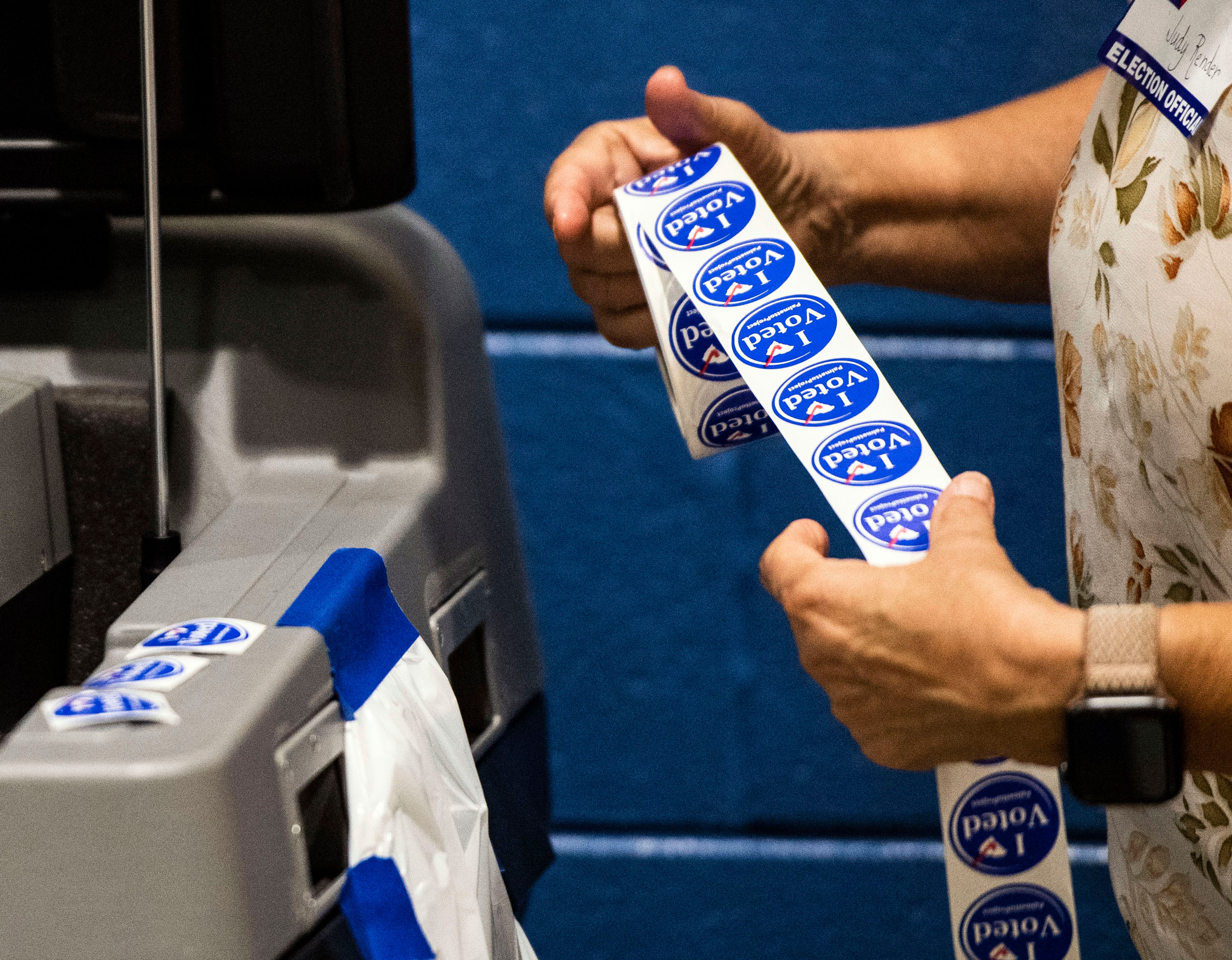 An election official prepares stickers for voters in Greenville, South Carolina, on Tuesday