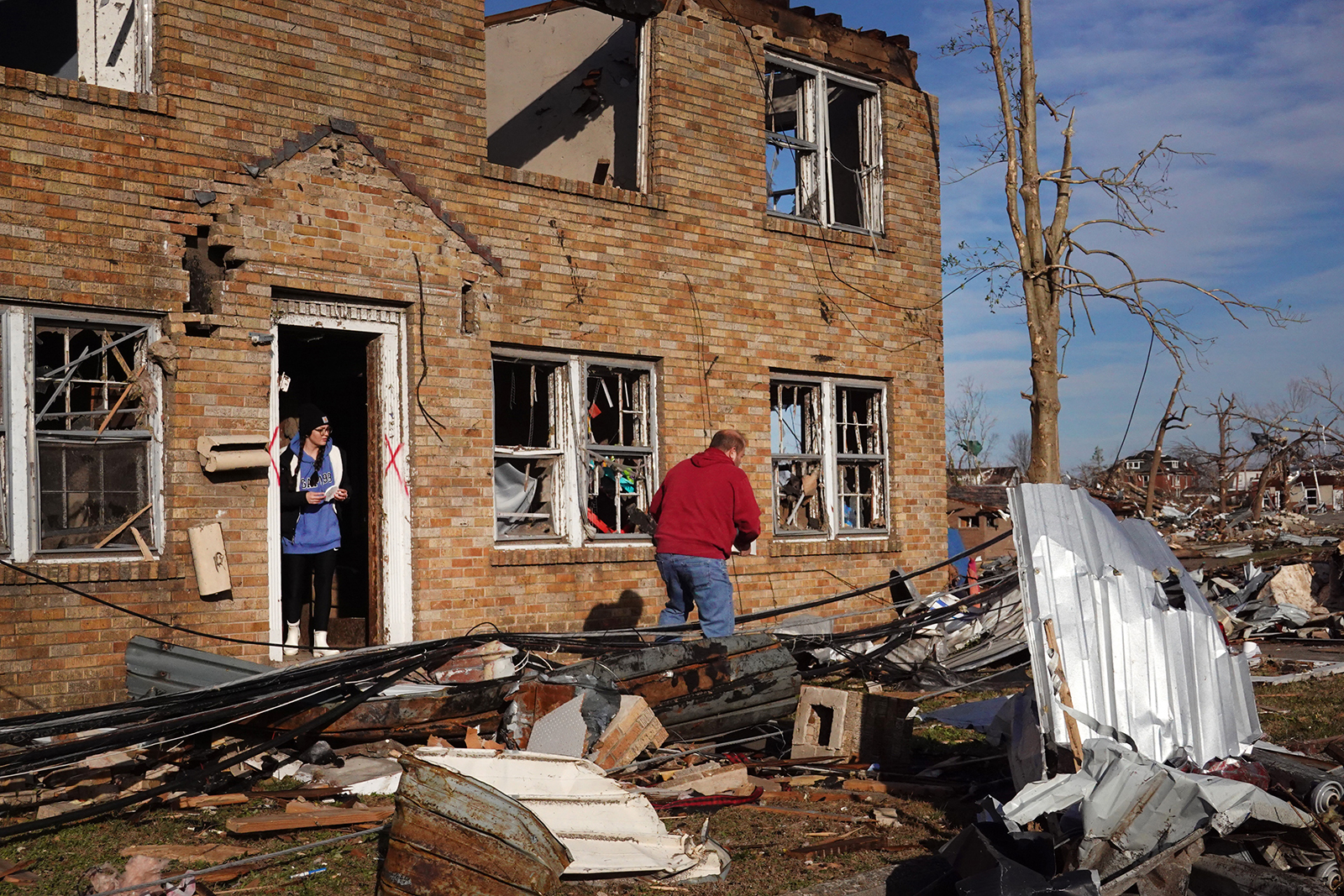 Residents begin the process of salvaging their belongings after a tornado ripped through the area the previous evening on December 11, in Mayfield, Kentucky. (Scott Olson/Getty Images)