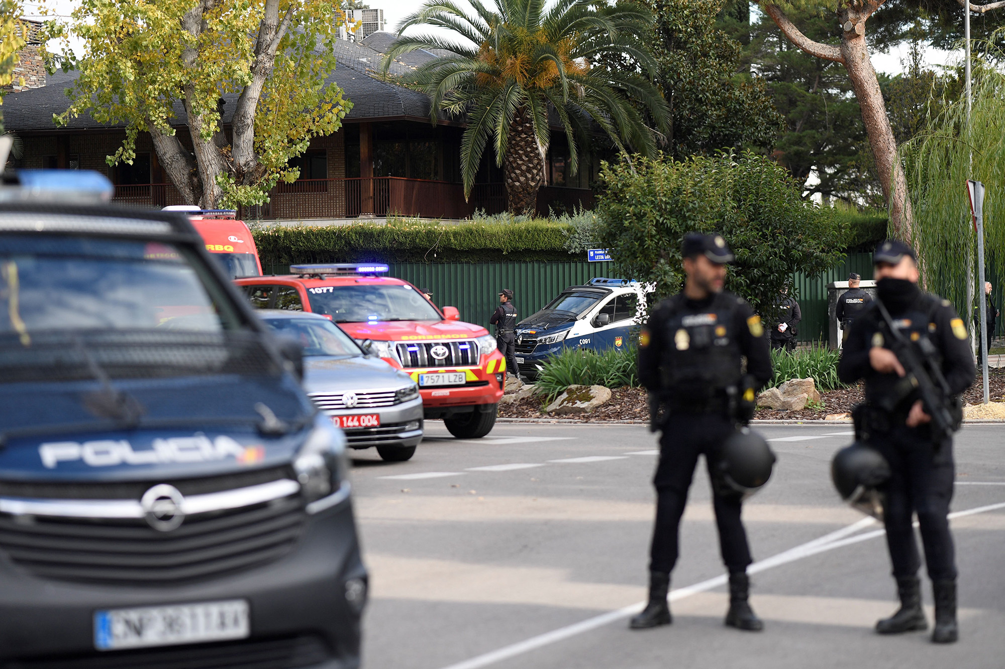Spanish policemen secure the area after a letter bomb explosion at the Ukraine's embassy in Madrid, Spain, on November 30.