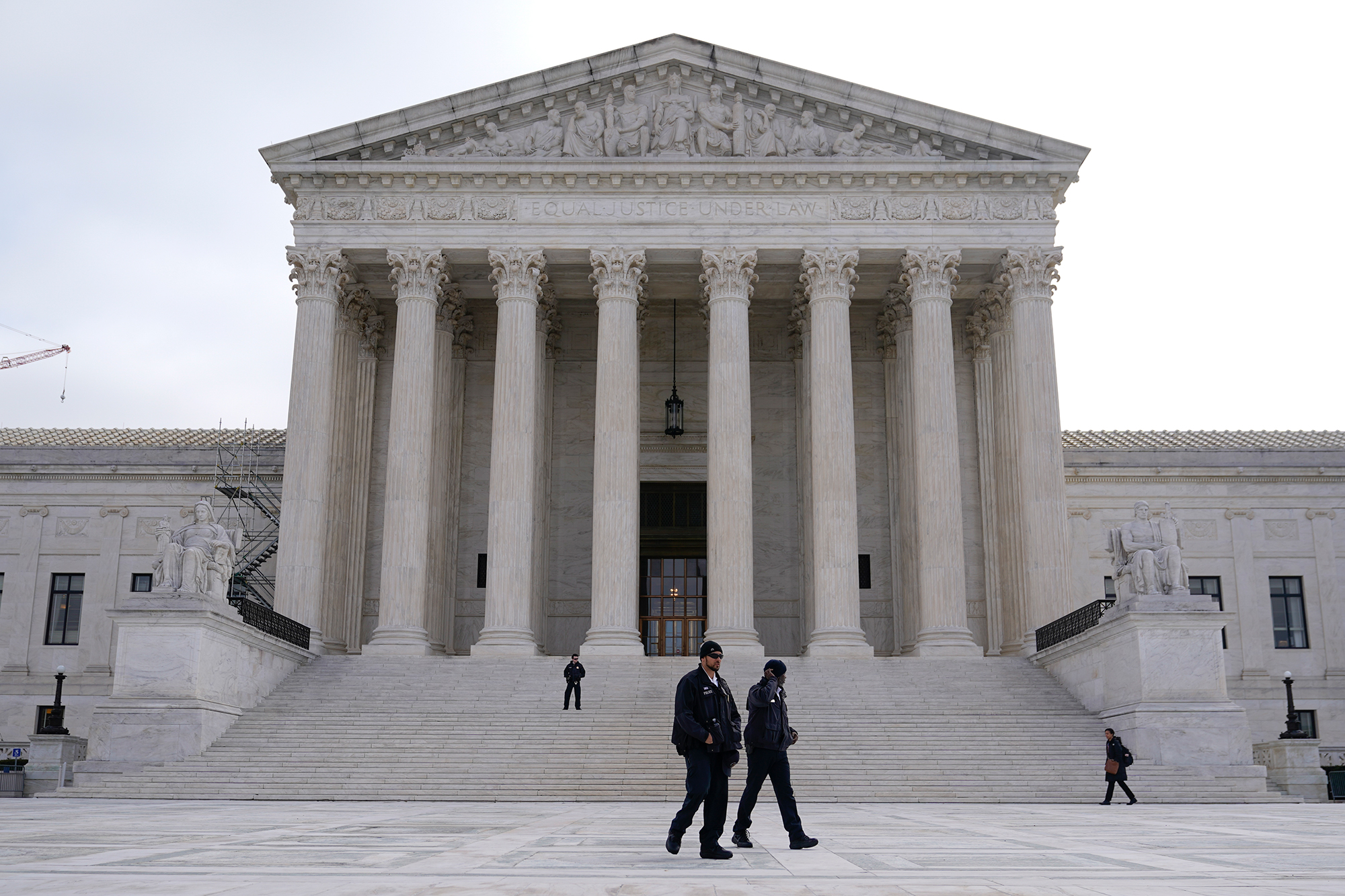 Police officers walk outside the Supreme Court on Capitol Hill in Washington, DC on Tuesday.