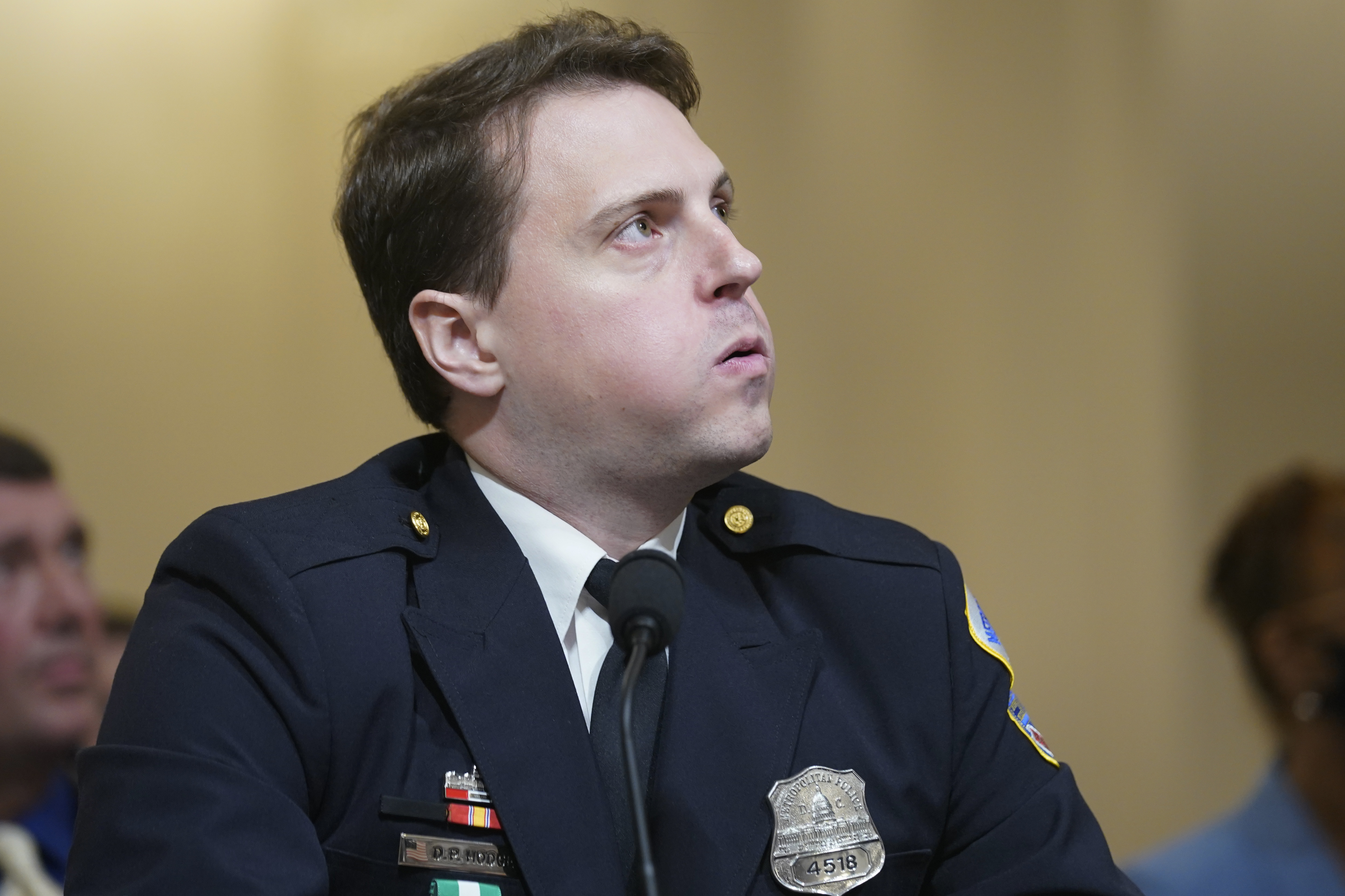 Metropolitan Police Department Officer Daniel Hodges watches video from his body camera during the House select committee hearing on the January 6 attack on Capitol Hill on Tuesday, July 27.
