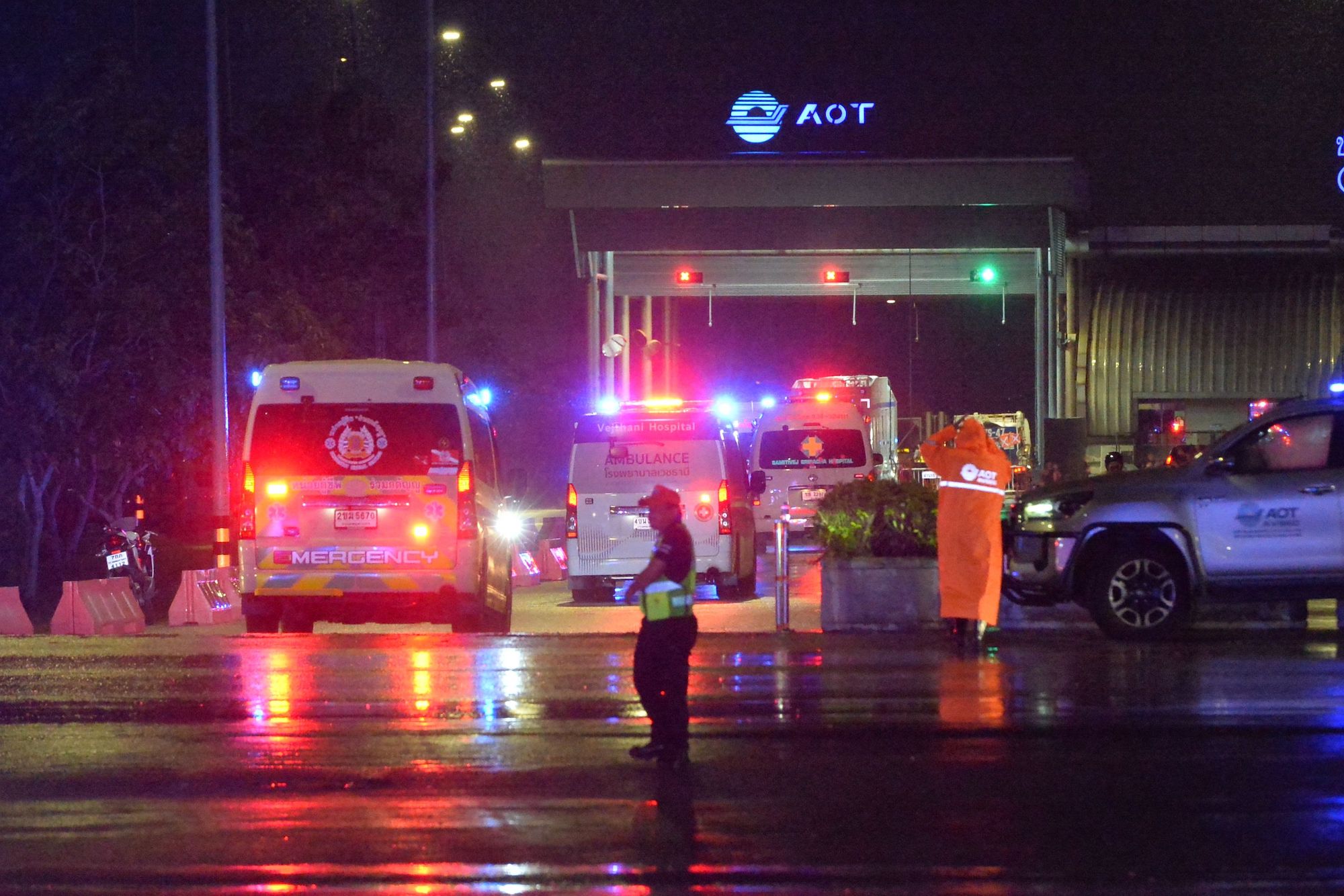 Ambulances are seen outside the Suvarnabhumi Airport in Bangkok, Thailand, on Tuesday.