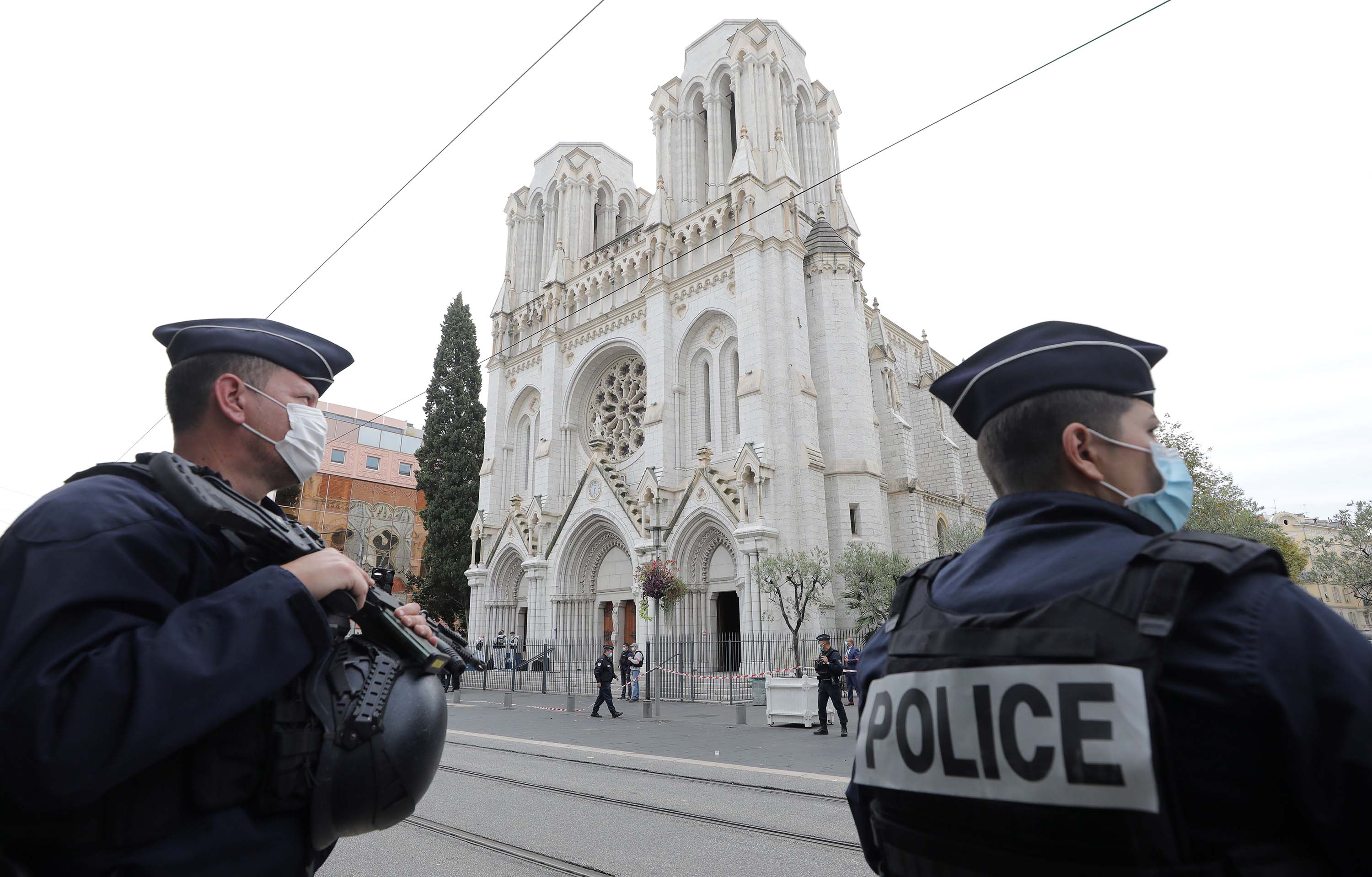 French policemen stand guard at the site of a knife attack at the Basilica of Notre-Dame de Nice on Thursday.