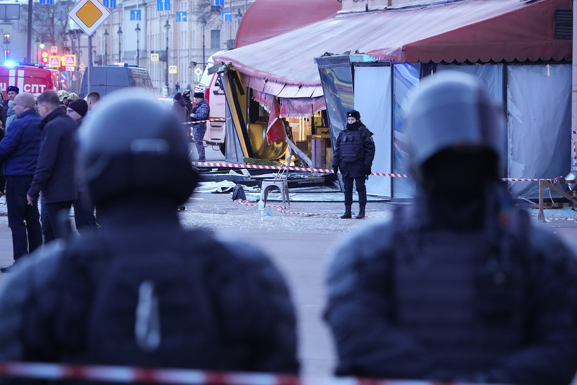 Russian police officers are seen at the site of an explosion at a cafe in St. Petersburg, Russia, on April 2.