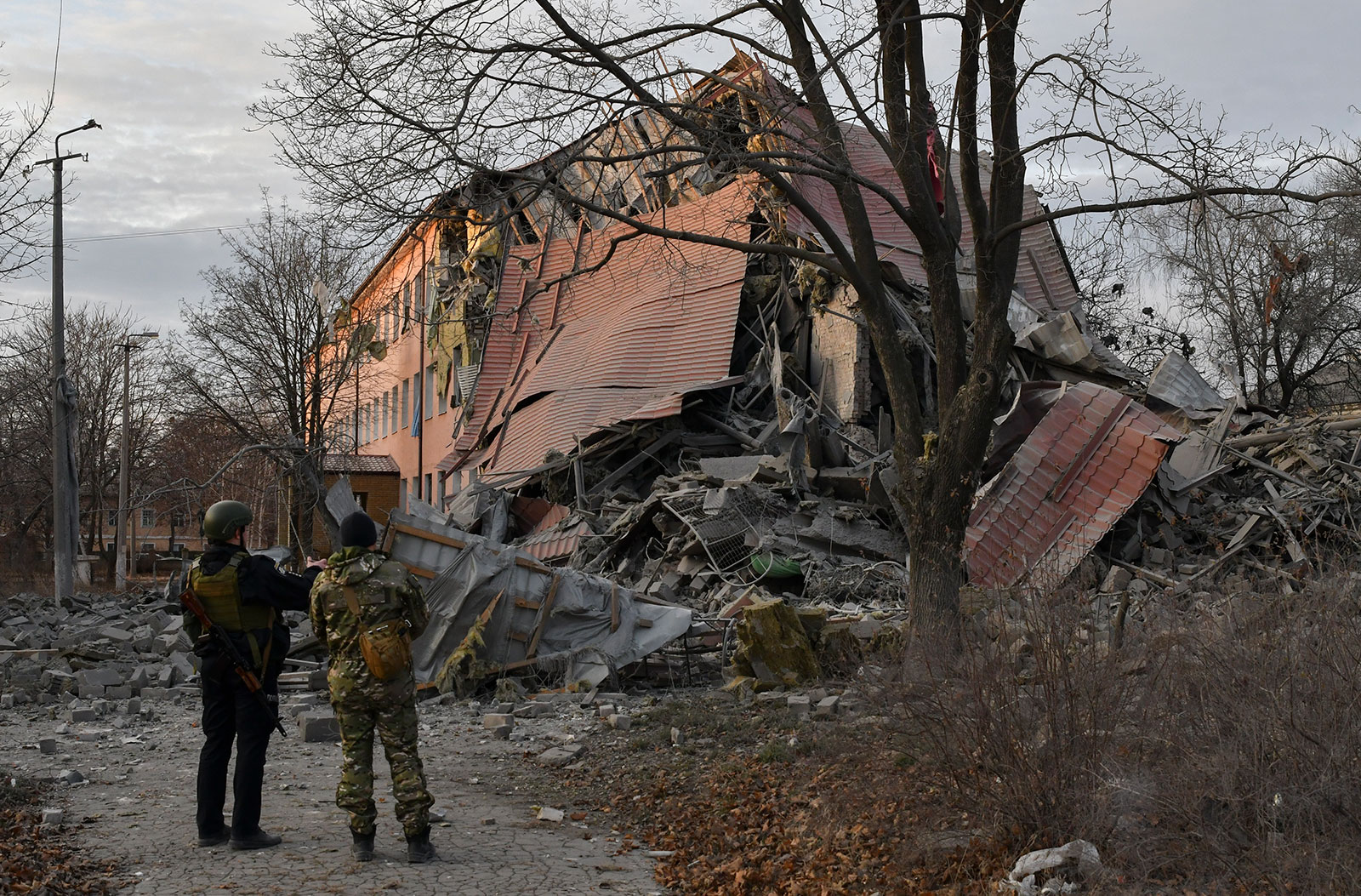 Police officers check a school that was damaged by Russian shelling in Kramatorsk, Ukraine, on December 22. 