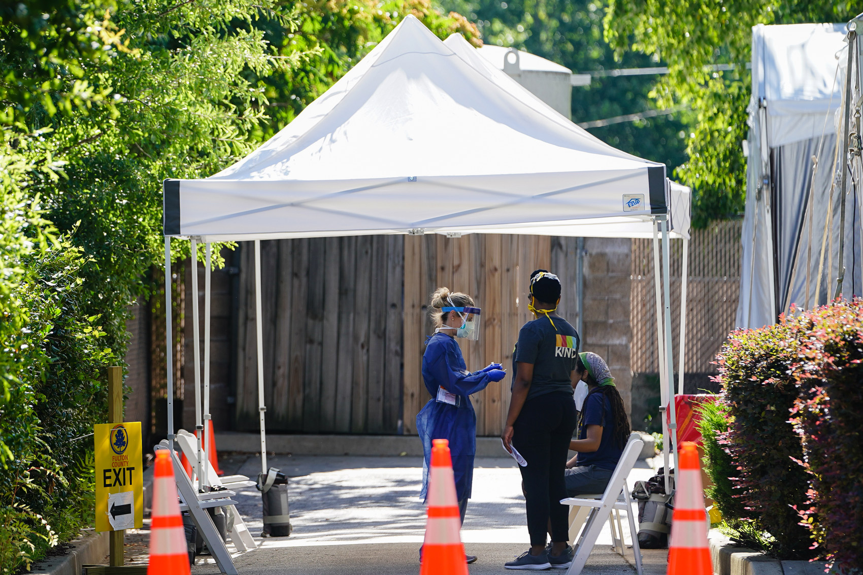 People get tested for COVID-19 at a free walk-up testing site on July 11 in Atlanta.