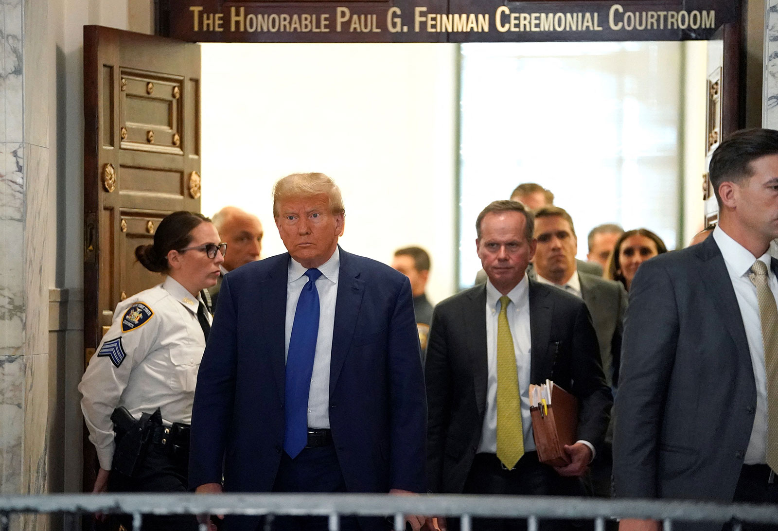Former President Donald Trump exits the courtroom during a break in his civil fraud trial on Wednesday.