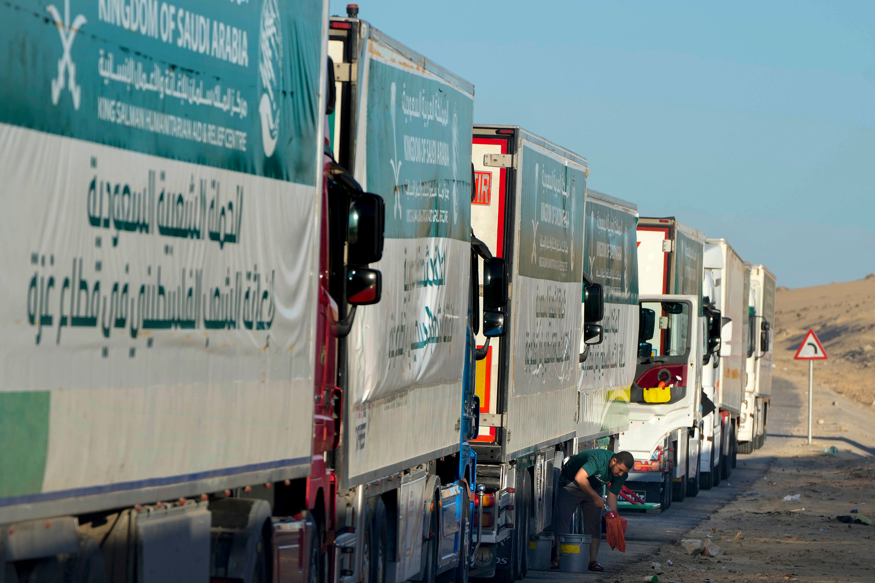 Trucks carrying humanitarian aid line up near the Rafah crossing into Gaza from Egypt on Wednesday.