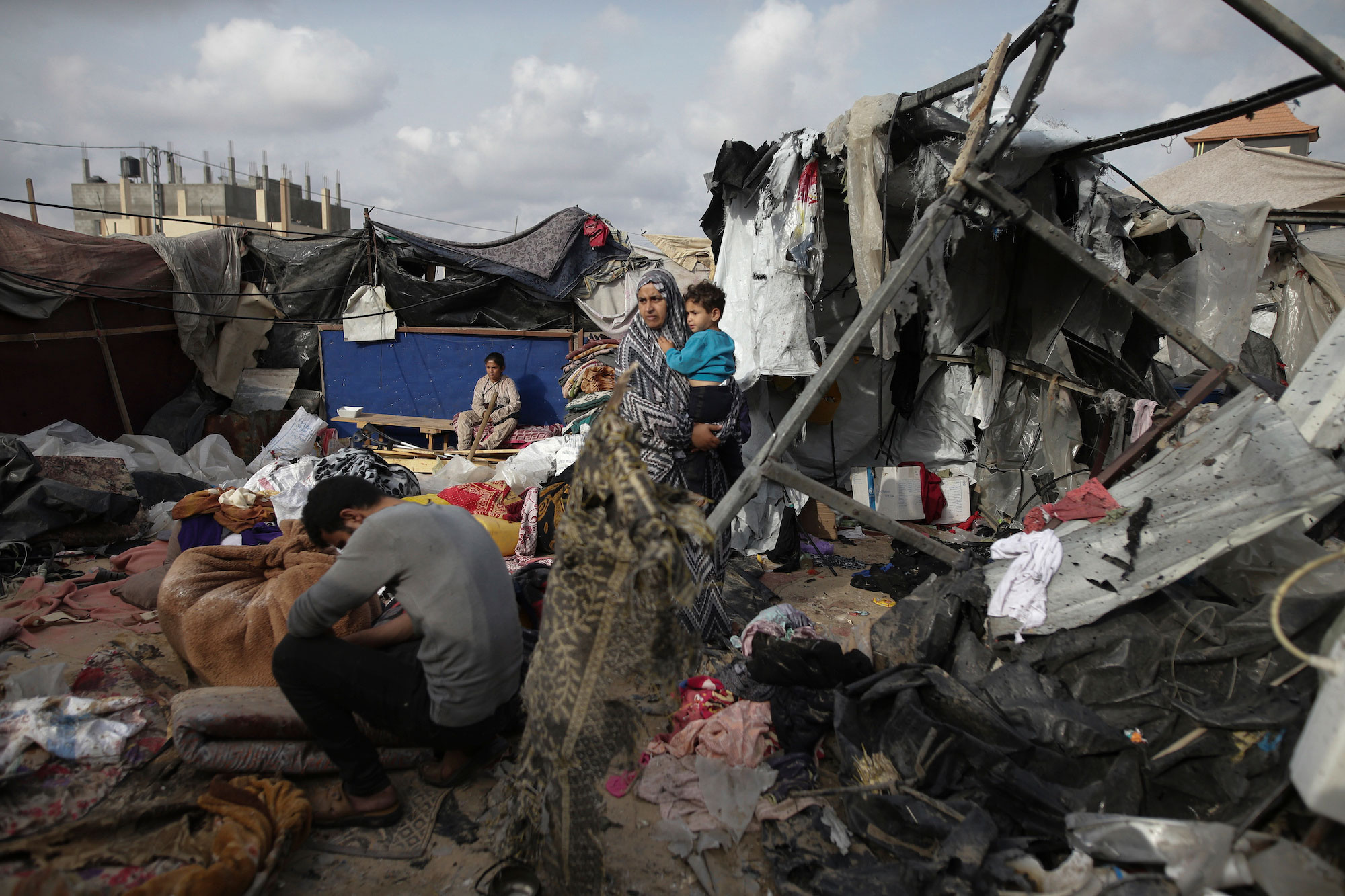 Displaced Palestinians inspect their tents destroyed by Israel’s bombardment west of Rafah, Gaza, on May 28.