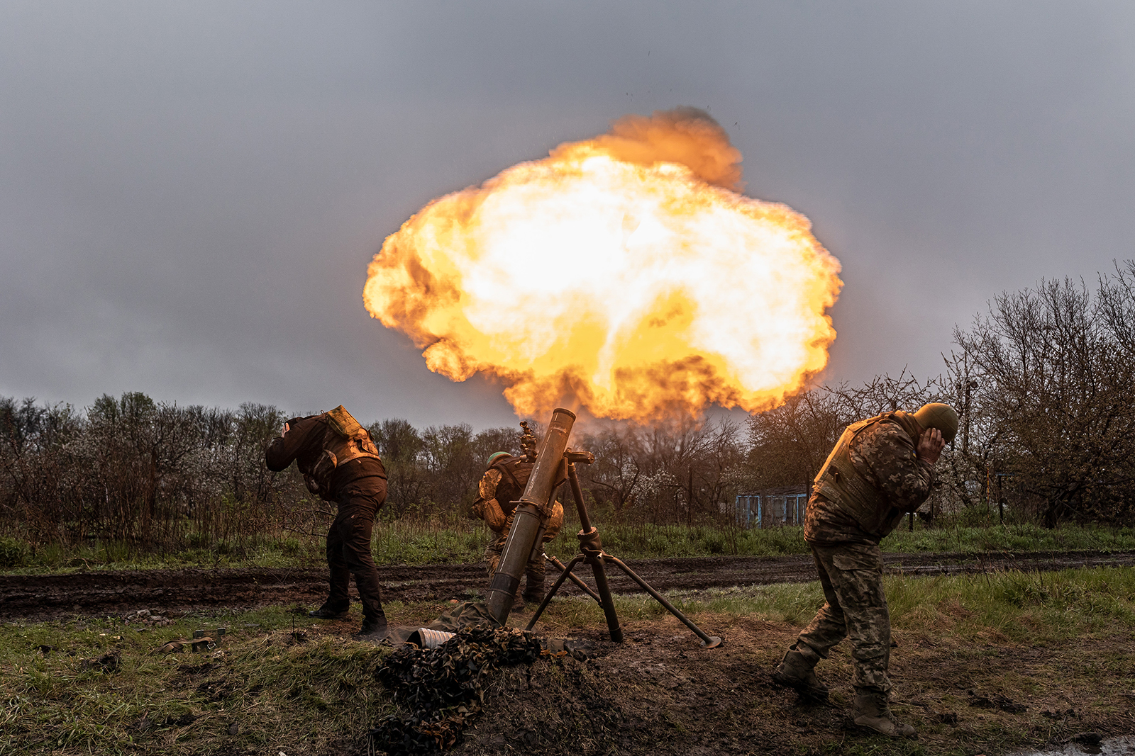 Ukrainian soldiers fire a mortar in the direction of Bakhmut, Ukraine, on April 20. 