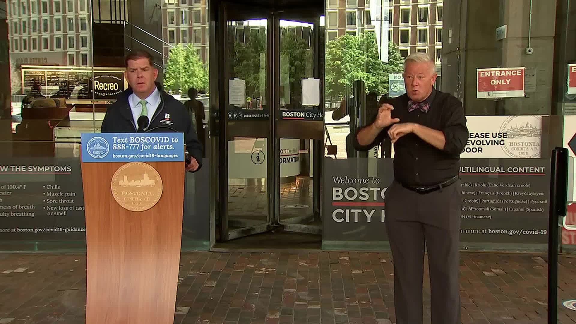 Boston Mayor Marty Walsh, left, addresses the media on Wednesday.