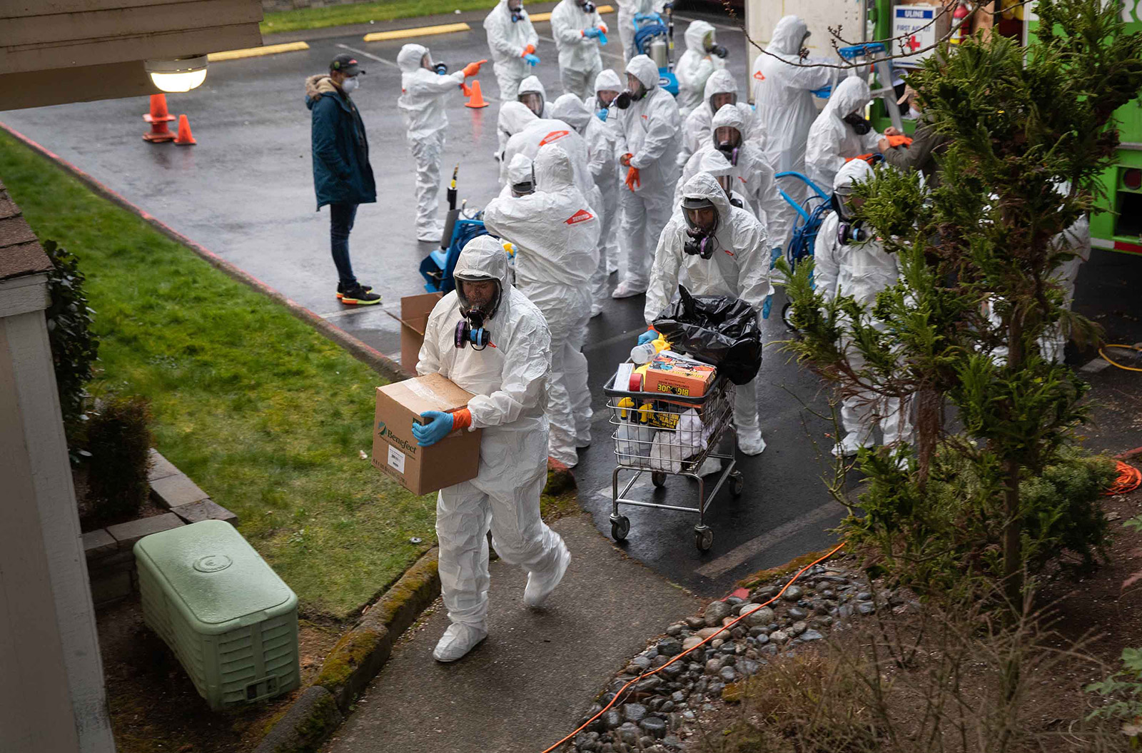 A cleaning crew enters the Life Care Center on the outskirts of Seattle on March 12.
