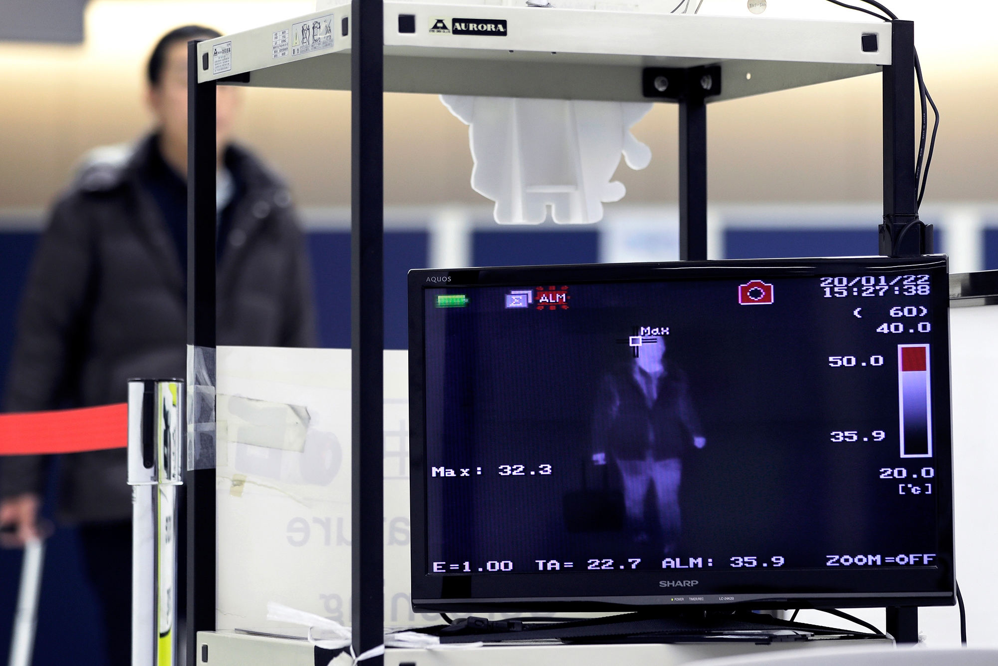 A monitor displays an image of a thermal scanner as a passenger passes through a quarantine station at Narita Airport in Narita, Chiba Prefecture, Japan.