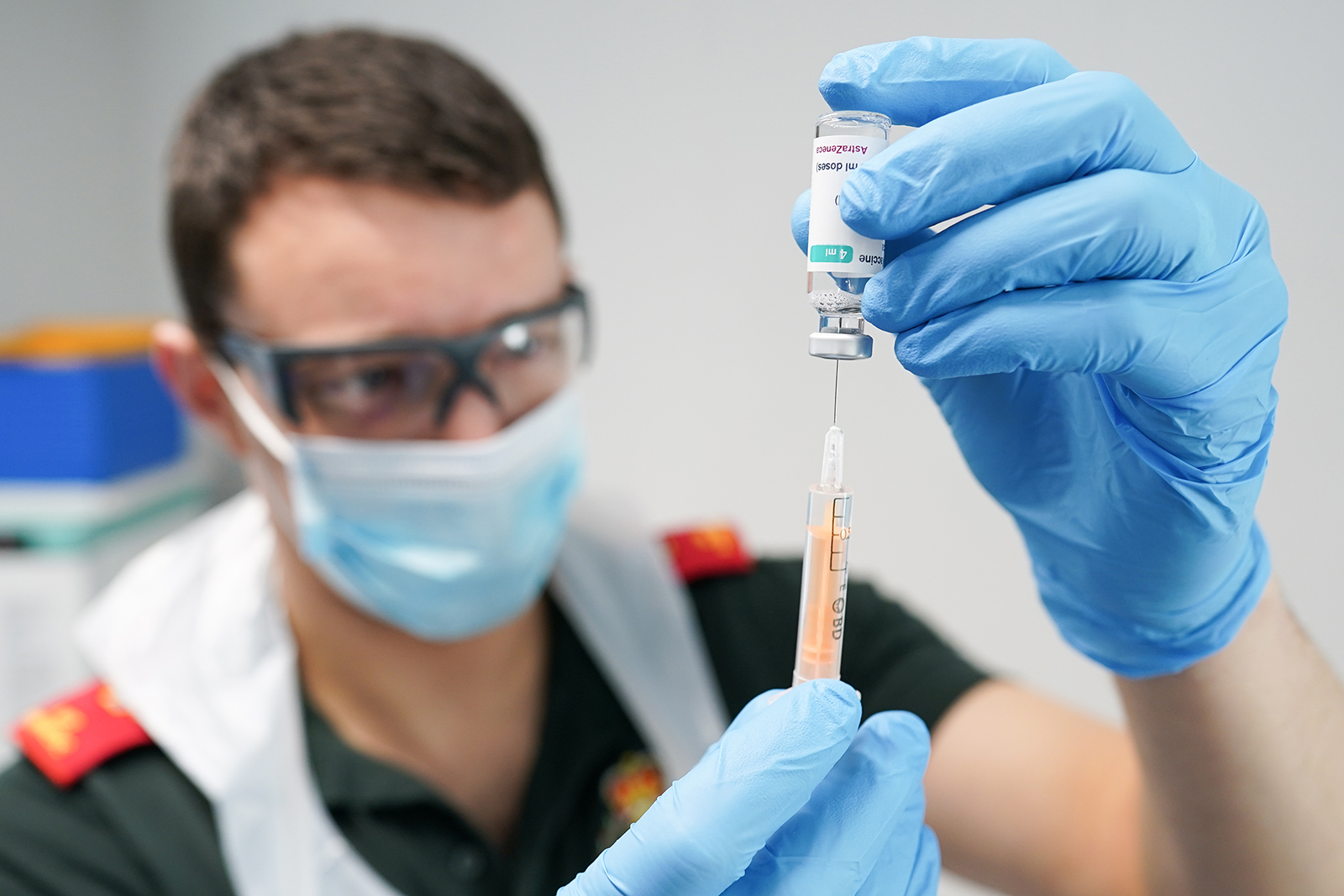 A paramedic draws up the Oxford-AstraZeneca Covid-19 vaccine at a vaccination center in Darlington, England, on March 1.