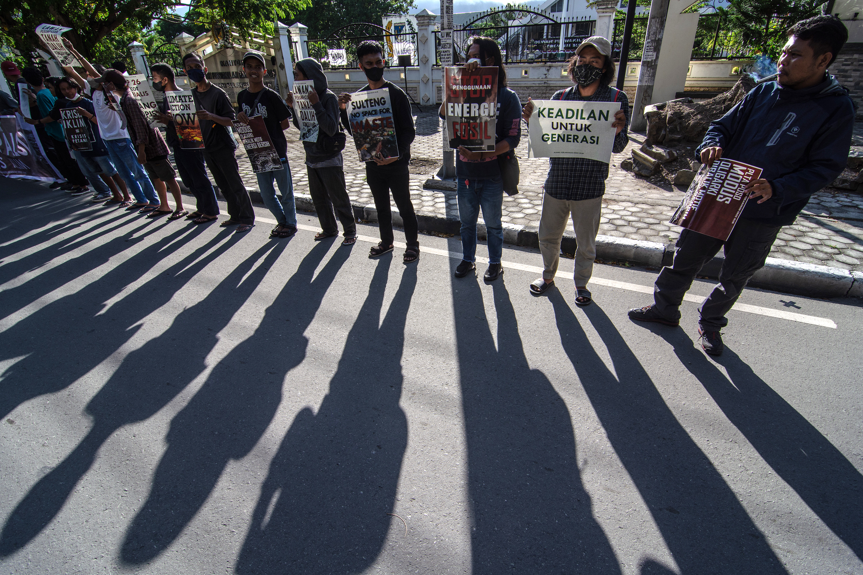 Members of the 'climate crisis resistance alliance' hold a protest in Palu, Indonesia, on November 6. 