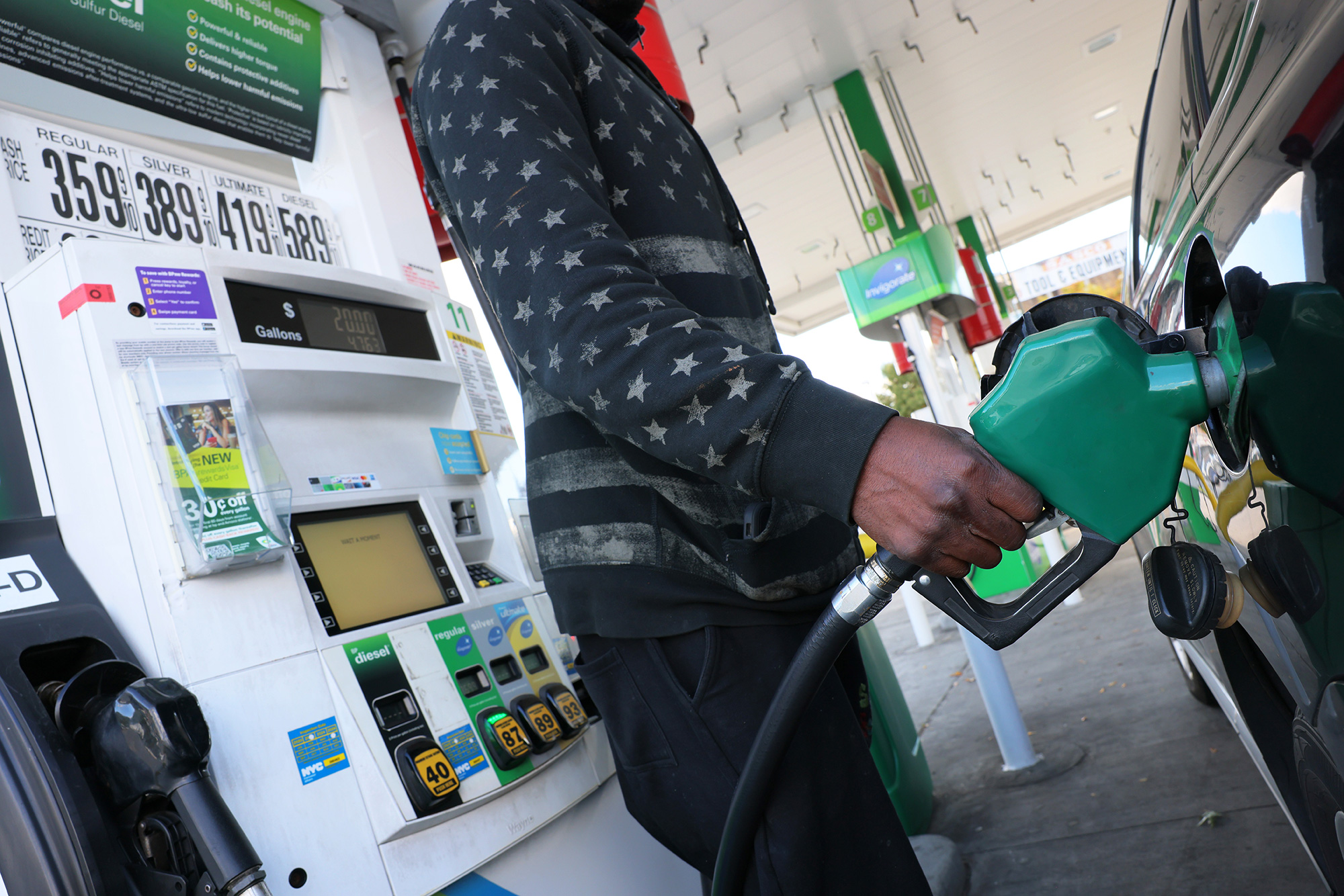  A person prepares to pump gas at a gas station in Brooklyn, New York, on October 19, 2022.