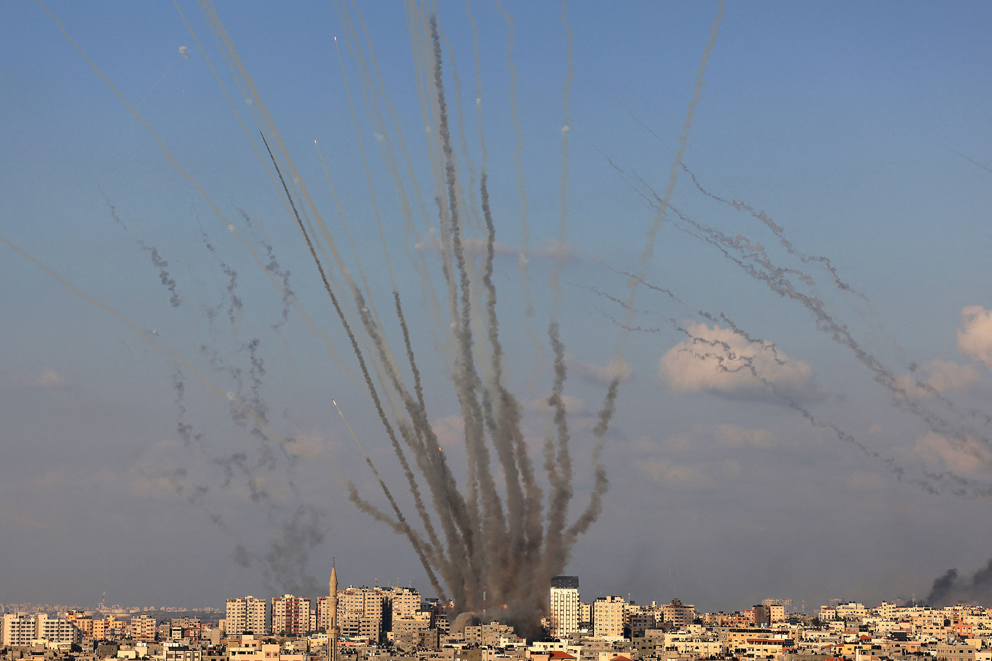 A salvo of rockets is fired by Palestinian militants from Gaza towards Israel on October 10.