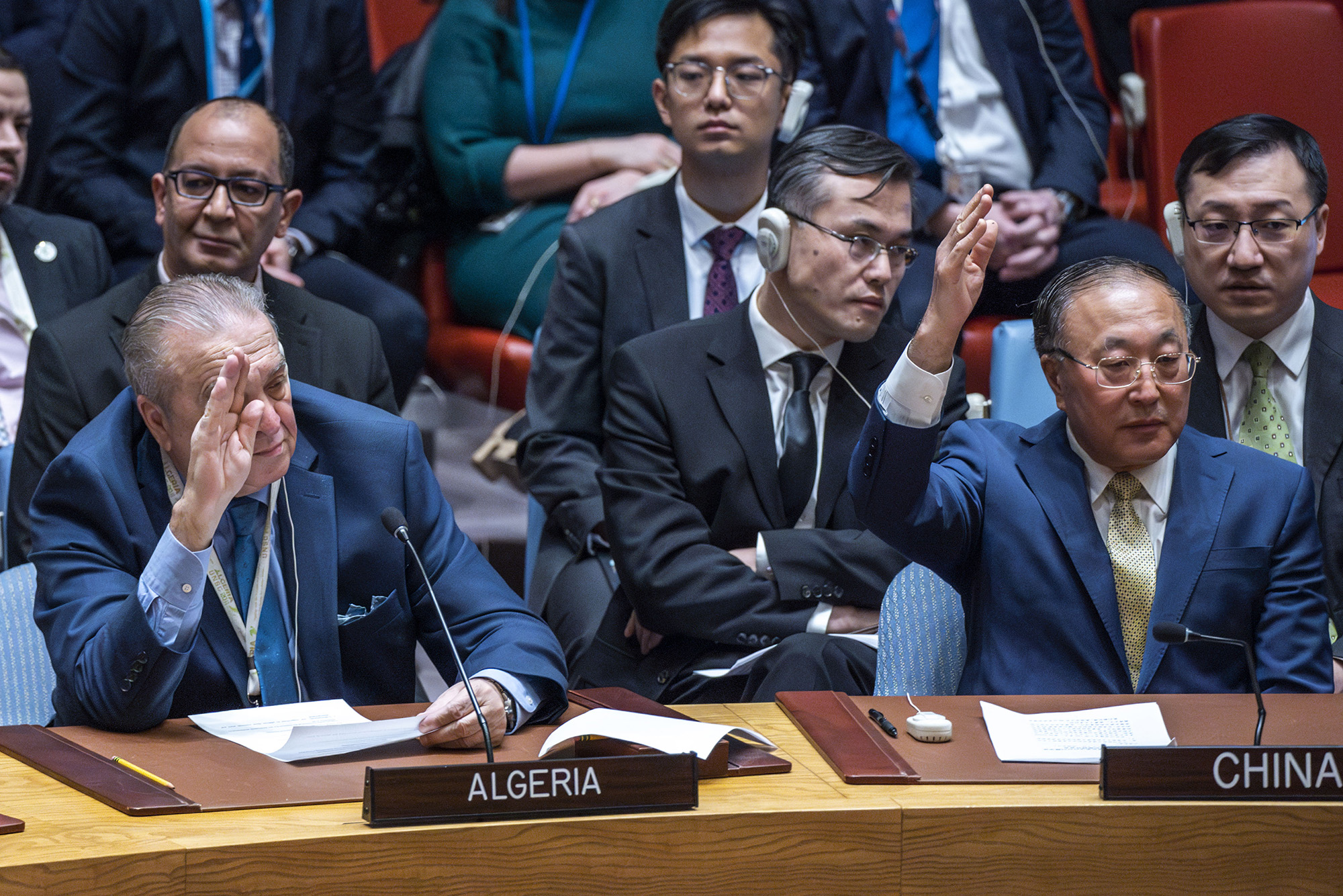 Permanent Representative of Algeria to the United Nations Amar Bendjama, left, and China's ambassador to the United Nations, Zhang Jun, vote against a U.S. ceasefire resolution during a UN Security Council meeting at the United Nations headquarters on March 22.