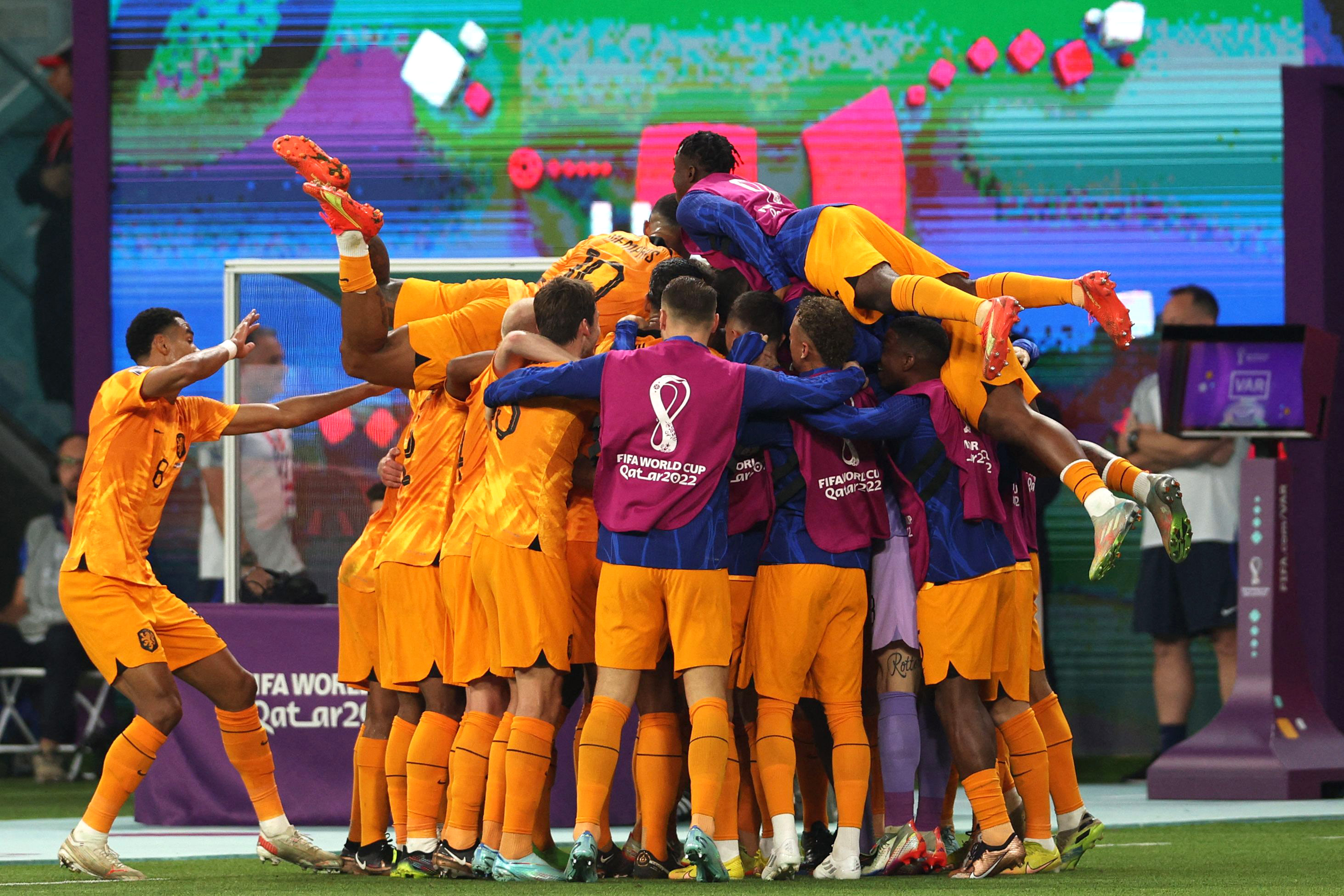 Netherlands players celebrate after scoring their second goal against the US on Saturday, December 3. 