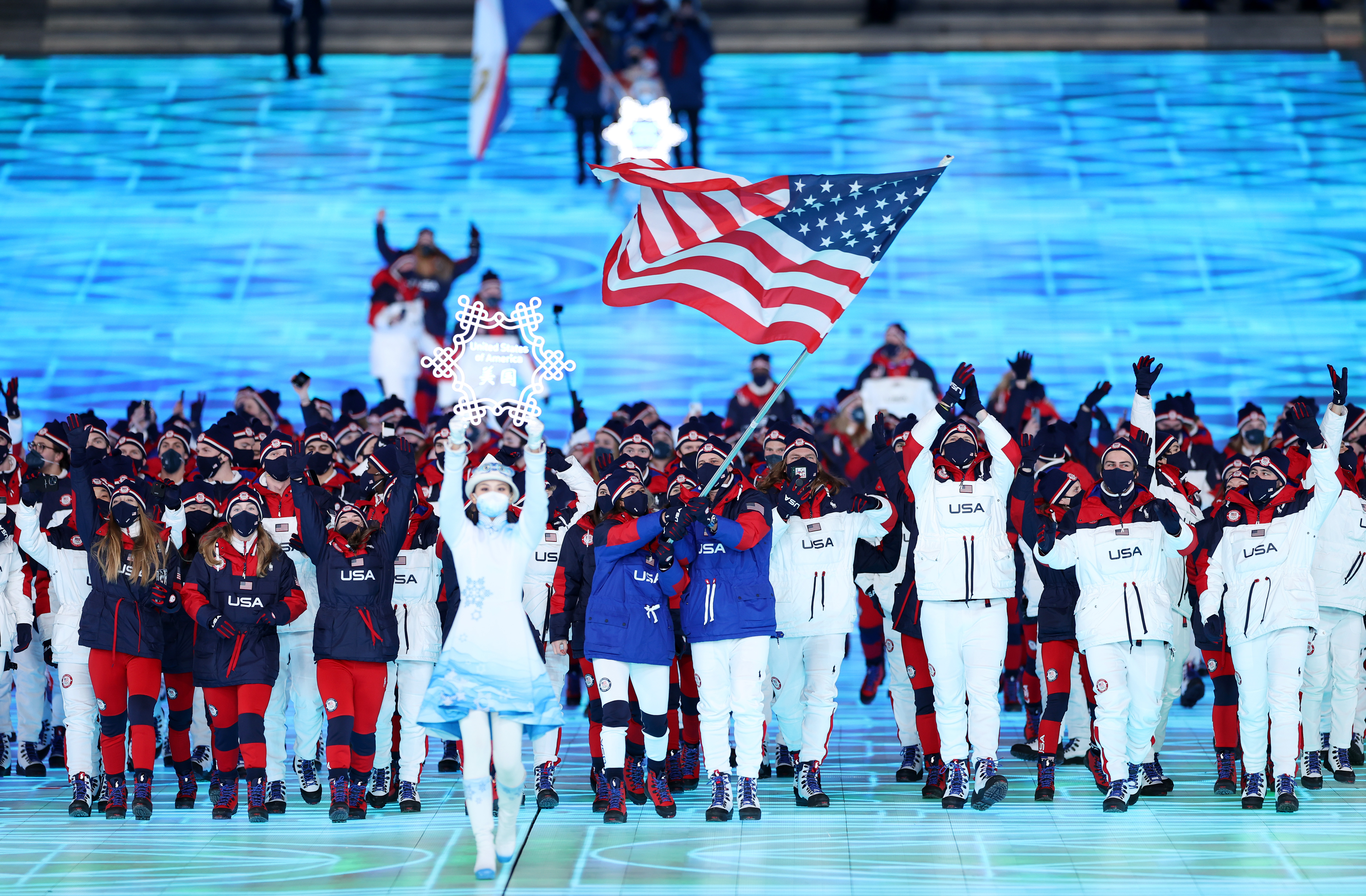 Flag bearers Brittany Bowe and John Shuster of Team United States carry their flag during the Opening Ceremony of the Beijing 2022 Winter Olympics at the Beijing National Stadium on February 04 in Beijing, China.