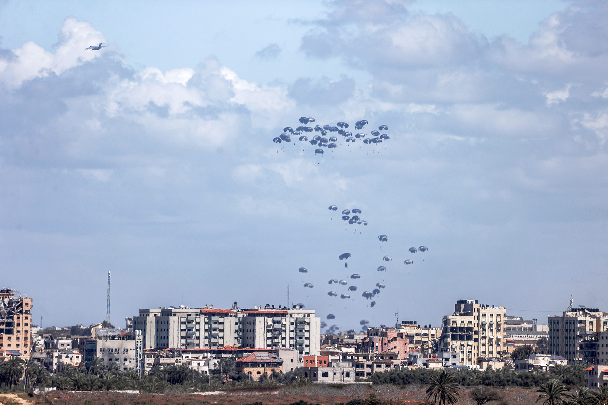 Planes drop humanitarian aid over northern Gaza on March 15.