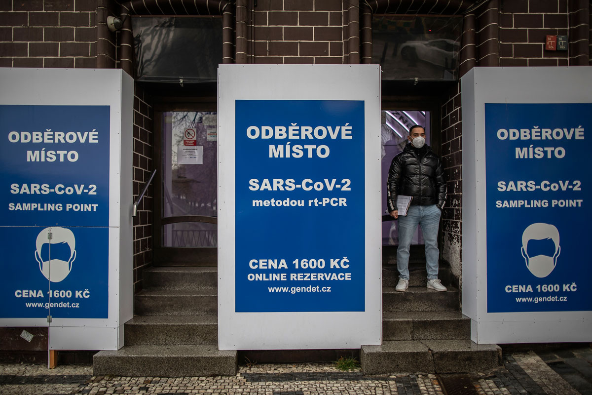 A man waits outside a sampling point for Covid-19 testing in Prague, Czech Republic on January 3.