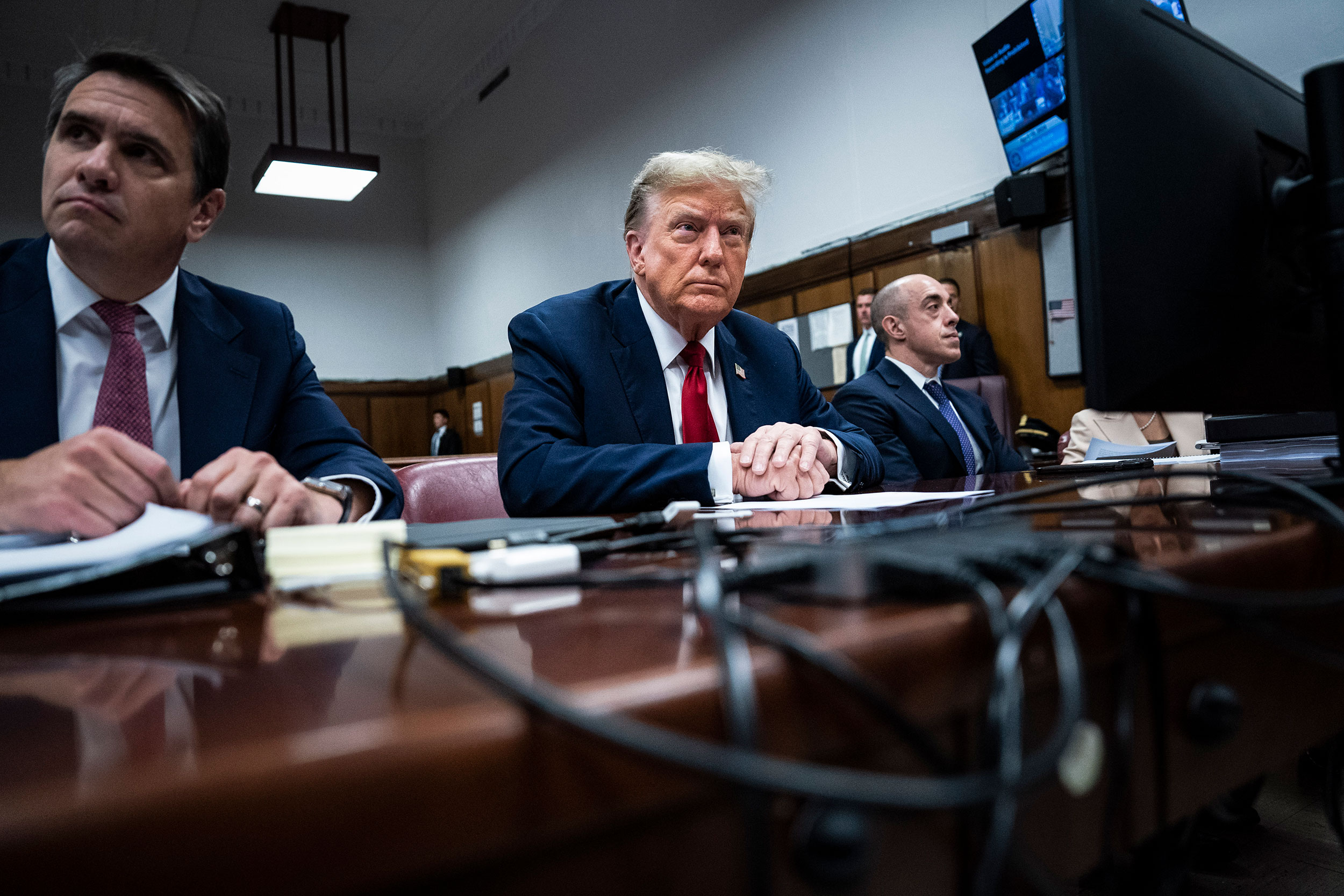 Former President Donald Trump appears with his legal team Todd Blanch and Emil Bove before the start of his trial in Manhattan Criminal Court on Monday, April 15.