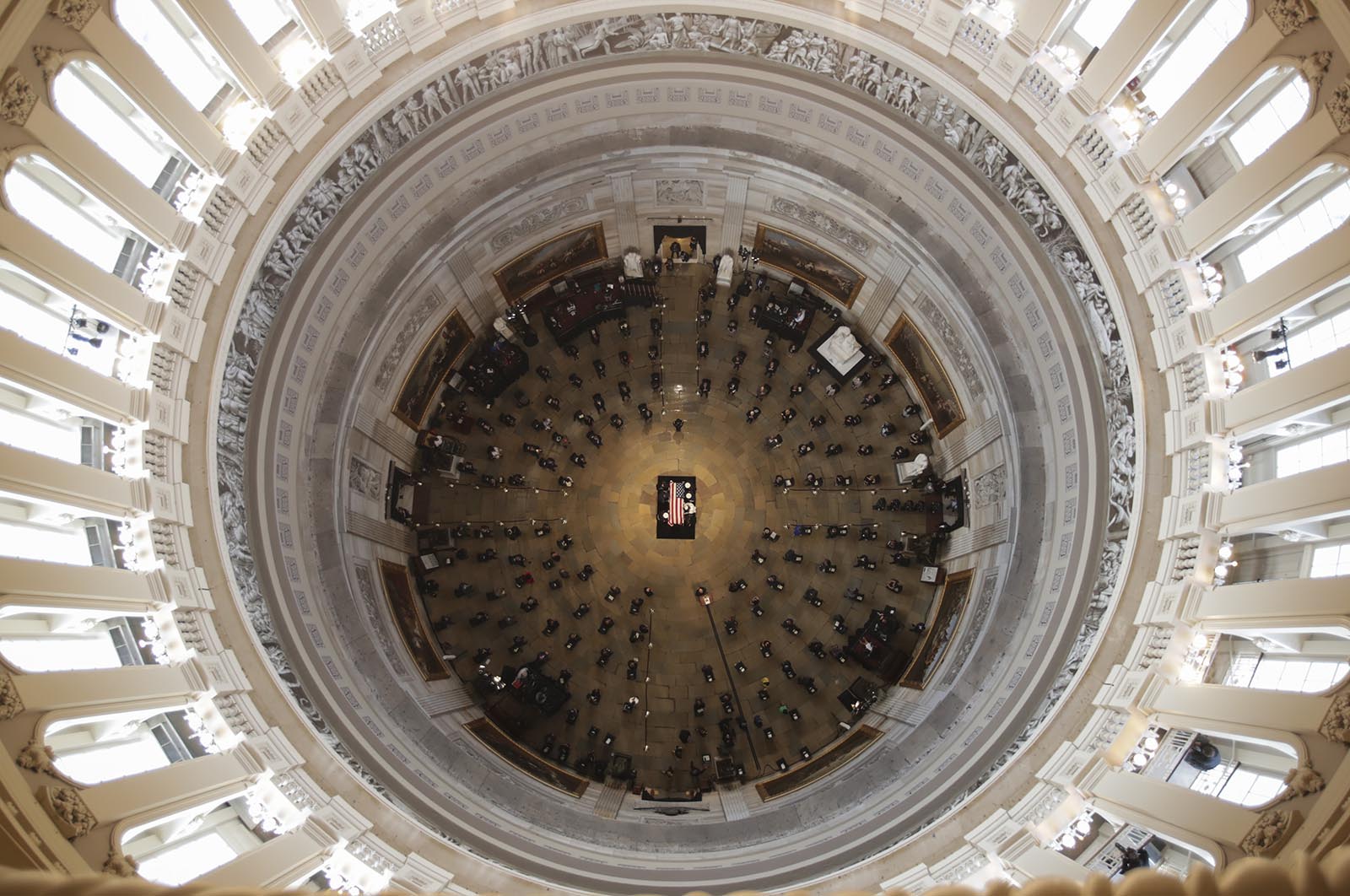 The flag-draped casket of the late Rep. John Lewis is placed by a U.S. military honor guard at the center of the U.S. Capitol Rotunda to lie in state on July 27, in Washington. 