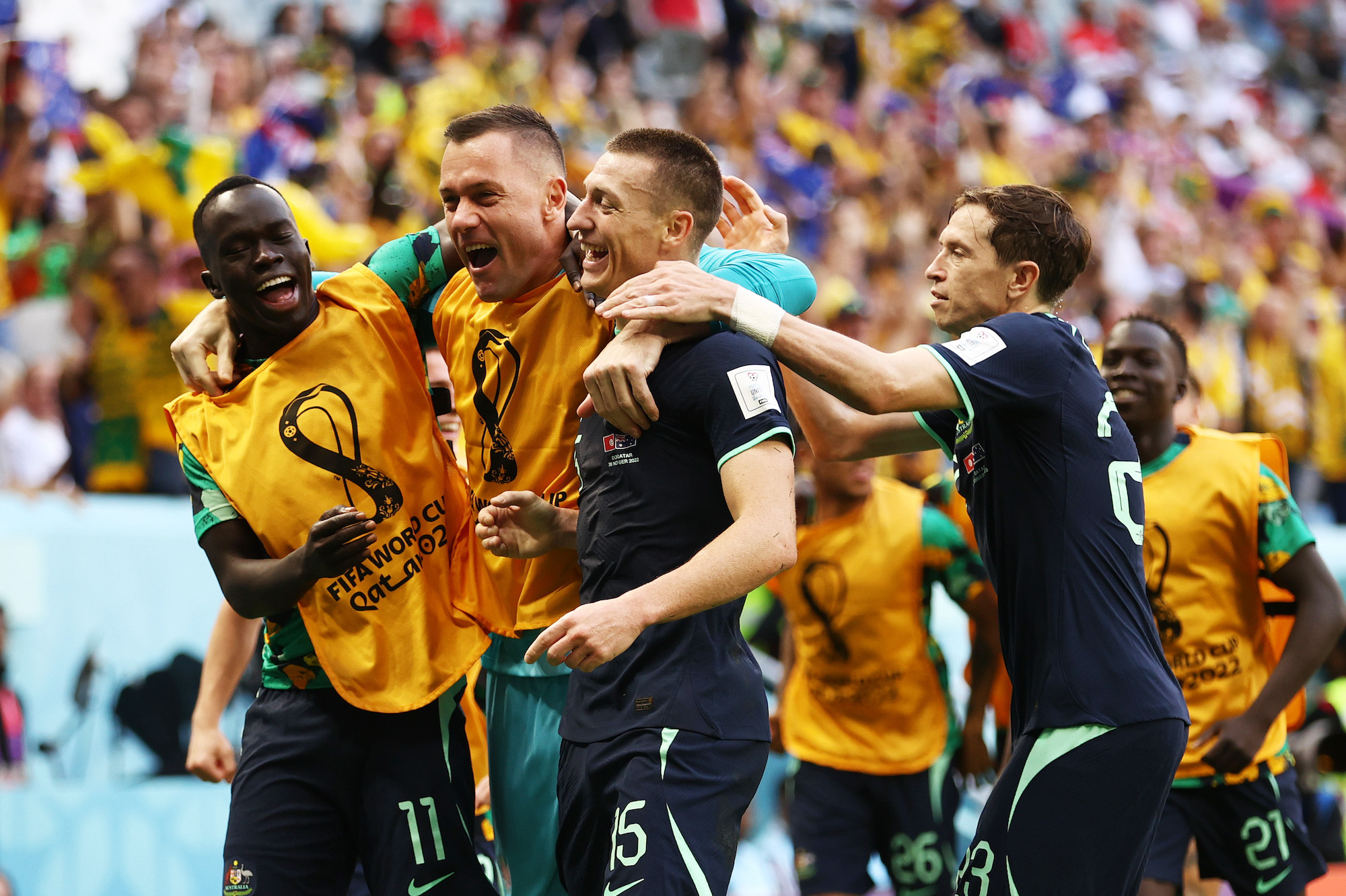 Australia’s Mitchell Duke celebrates with teammates after scoring a goal against Tunisia on Saturday. 