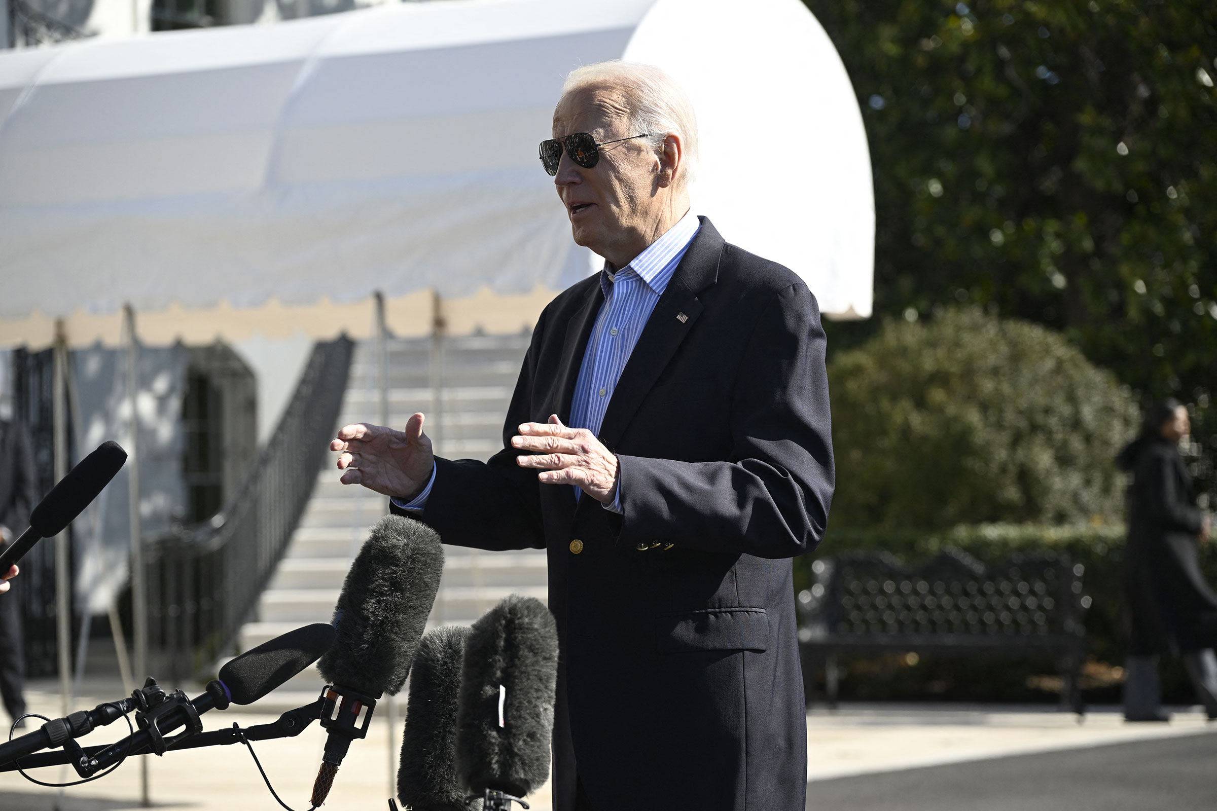President Joe Biden speaks to the press before boarding Marine One on the South Lawn of the White House in Washington, DC, on February 29. 