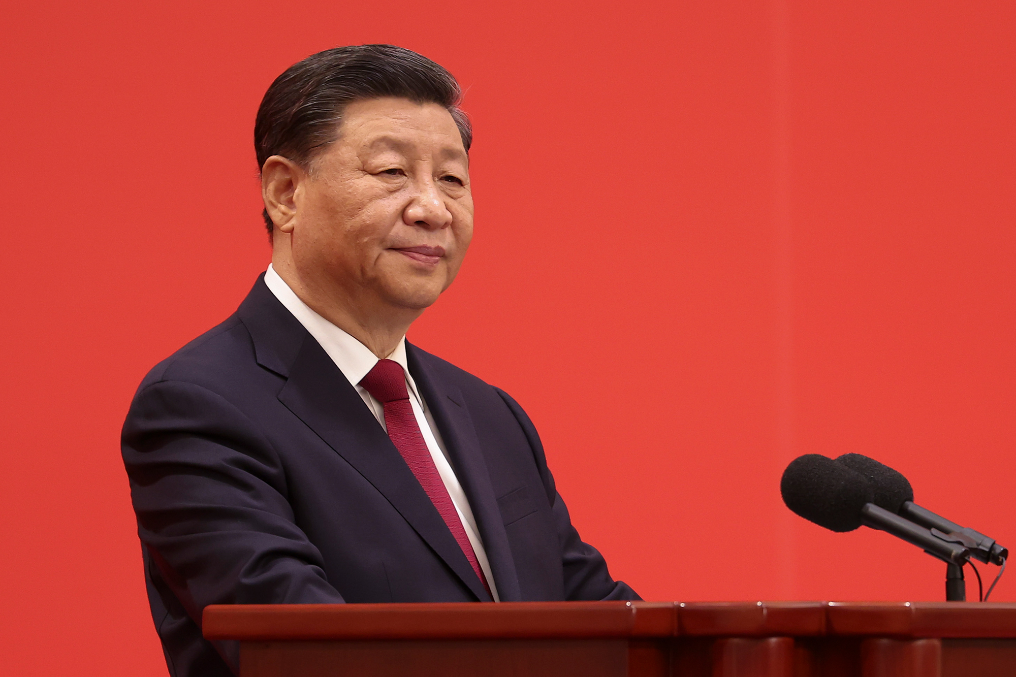 Chinese President Xi Jinping speaks at the podium during the meeting between members of the standing committee of the Political Bureau of the 20th CPC Central Committee and Chinese and foreign journalists at The Great Hall of People on October 23, 2022 in Beijing, China.