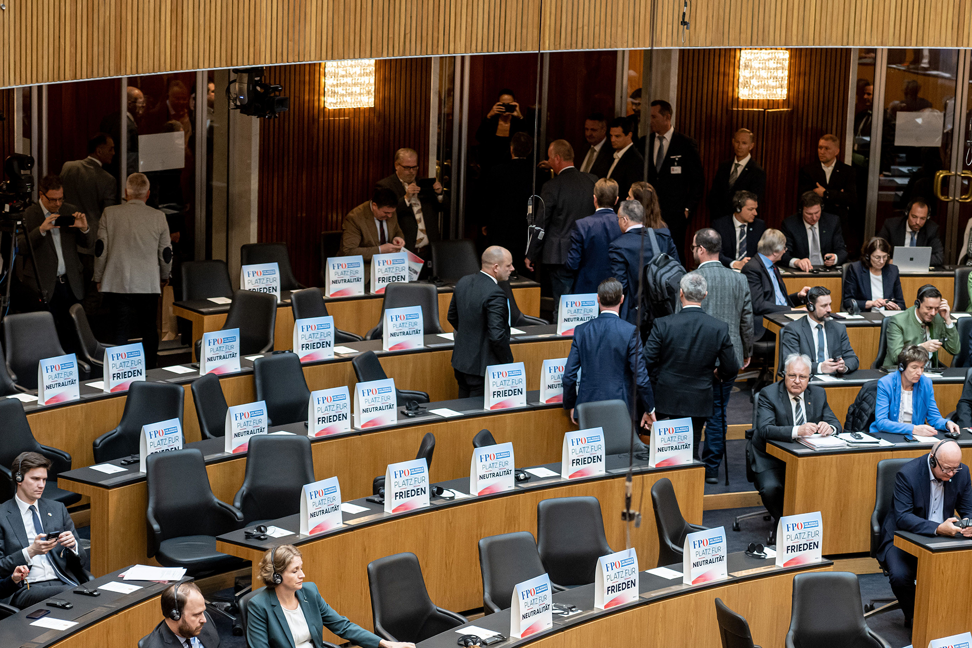 Austrian MPs from the right-wing Austrian Freedom Party (FPOe) leave the assembly room as a sign of protest during a video address by Ukraine's President Volodymyr Zelensky amid a session of the Austrian National Council in Vienna, Austria, on March 30.