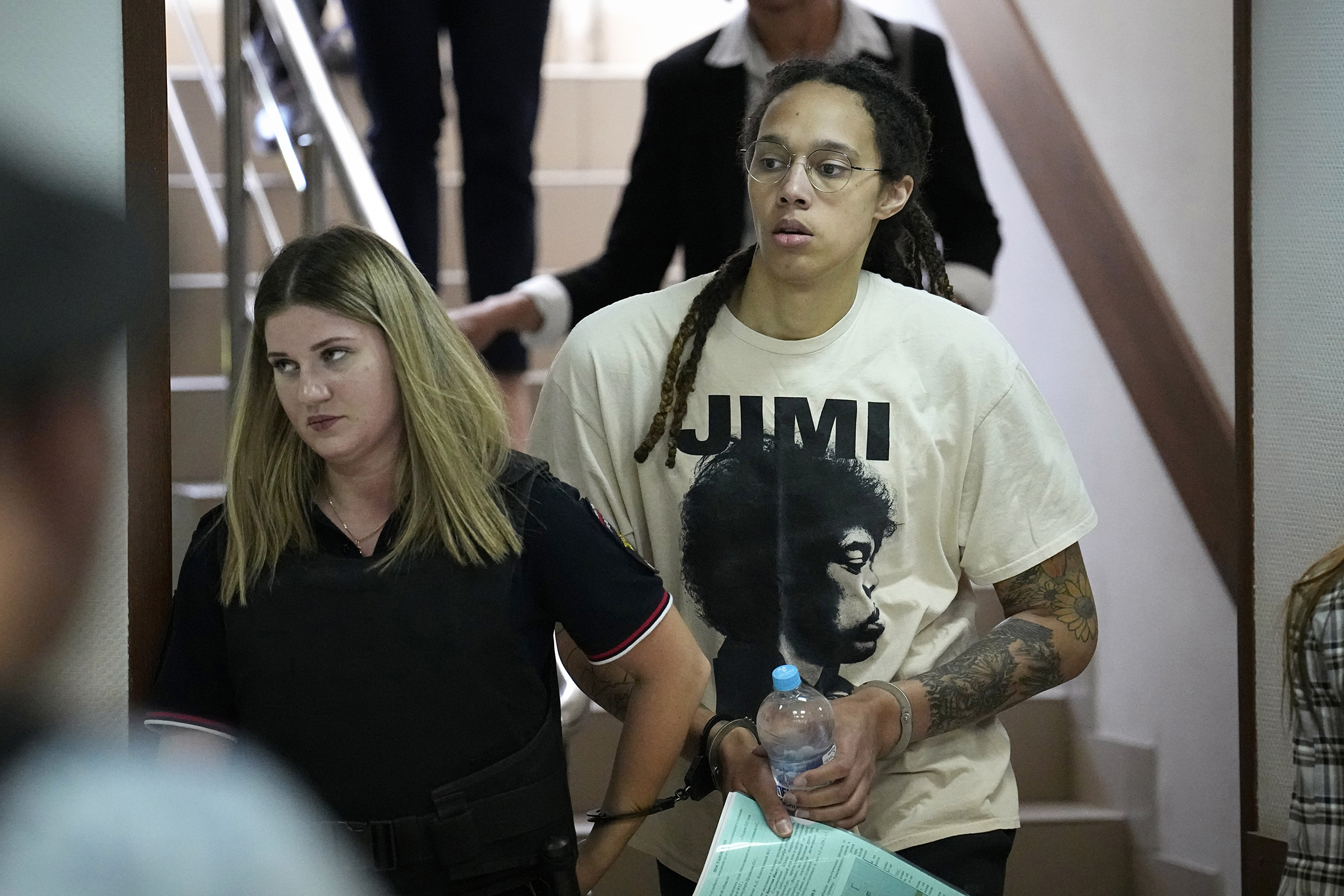 WNBA star and two-time Olympic gold medalist Brittney Griner is escorted to a courtroom for a hearing, in Khimki just outside Moscow, Russia, on July 1.