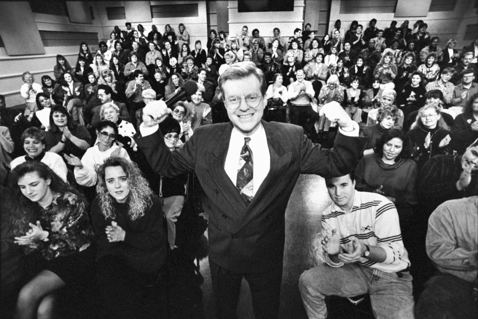 Jerry Springer poses with a studio audience during taping for “The Jerry Springer Show” in 1992. 