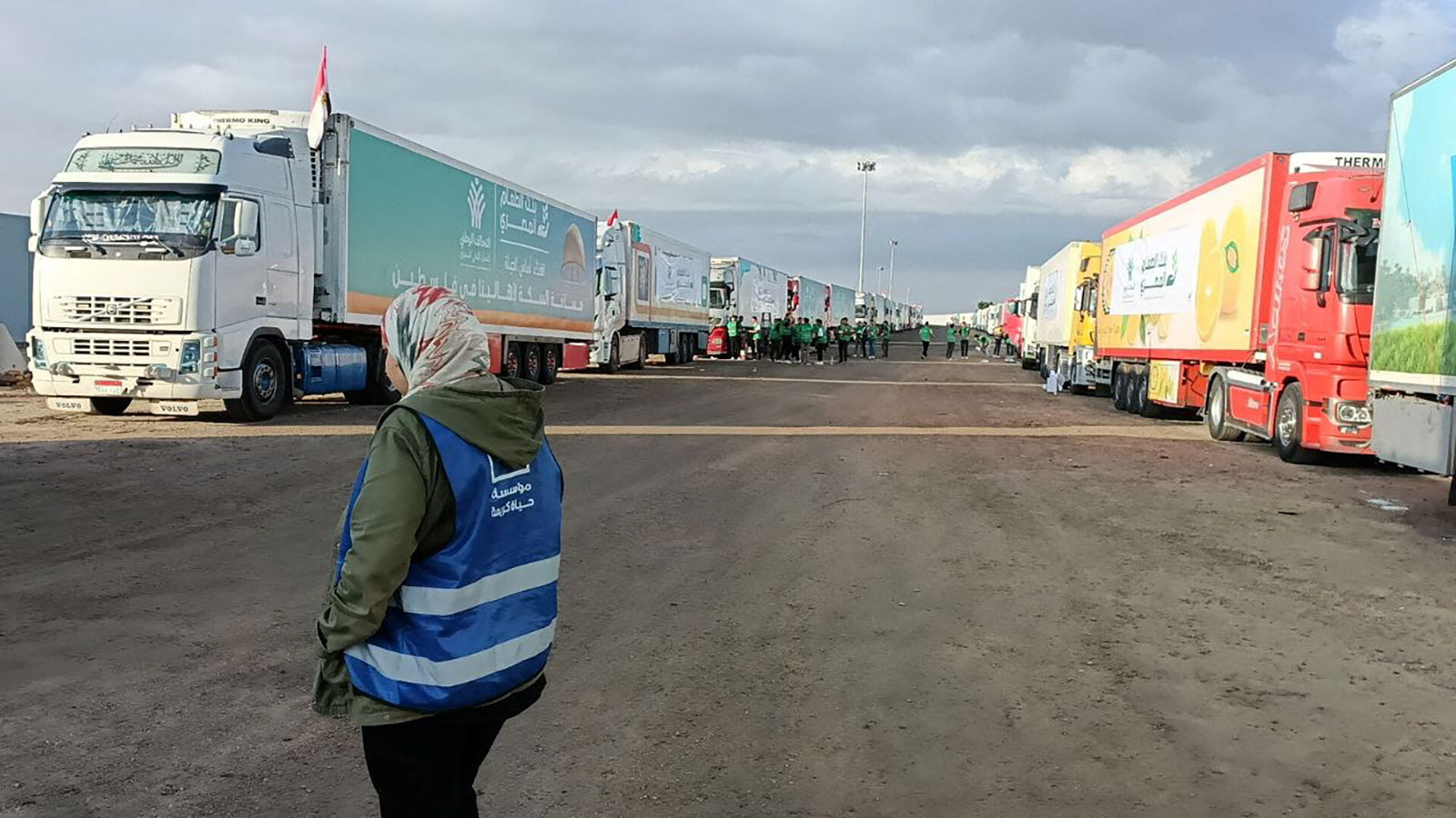 Trucks carrying humanitarian aid for Palestinians sit on the Egyptian side of the Rafah crossing on Tuesday waiting for the corridor into Gaza to reopen.