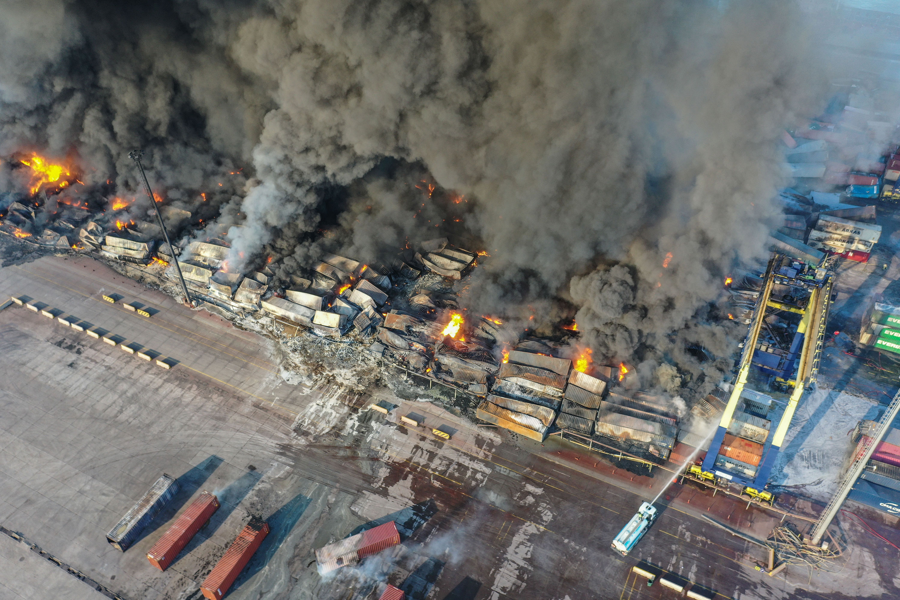 Fires rage at the Iskendurun port as firefighters try to extinguish the flames in Hatay Province, Turkey, on Wednesday.