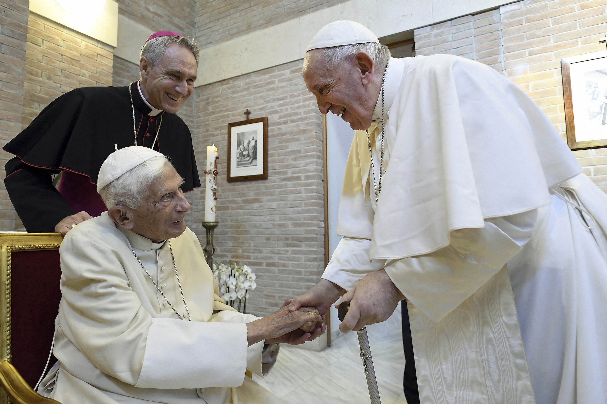 Pope Francis visits with Benedict at the Vatican in August 2022.