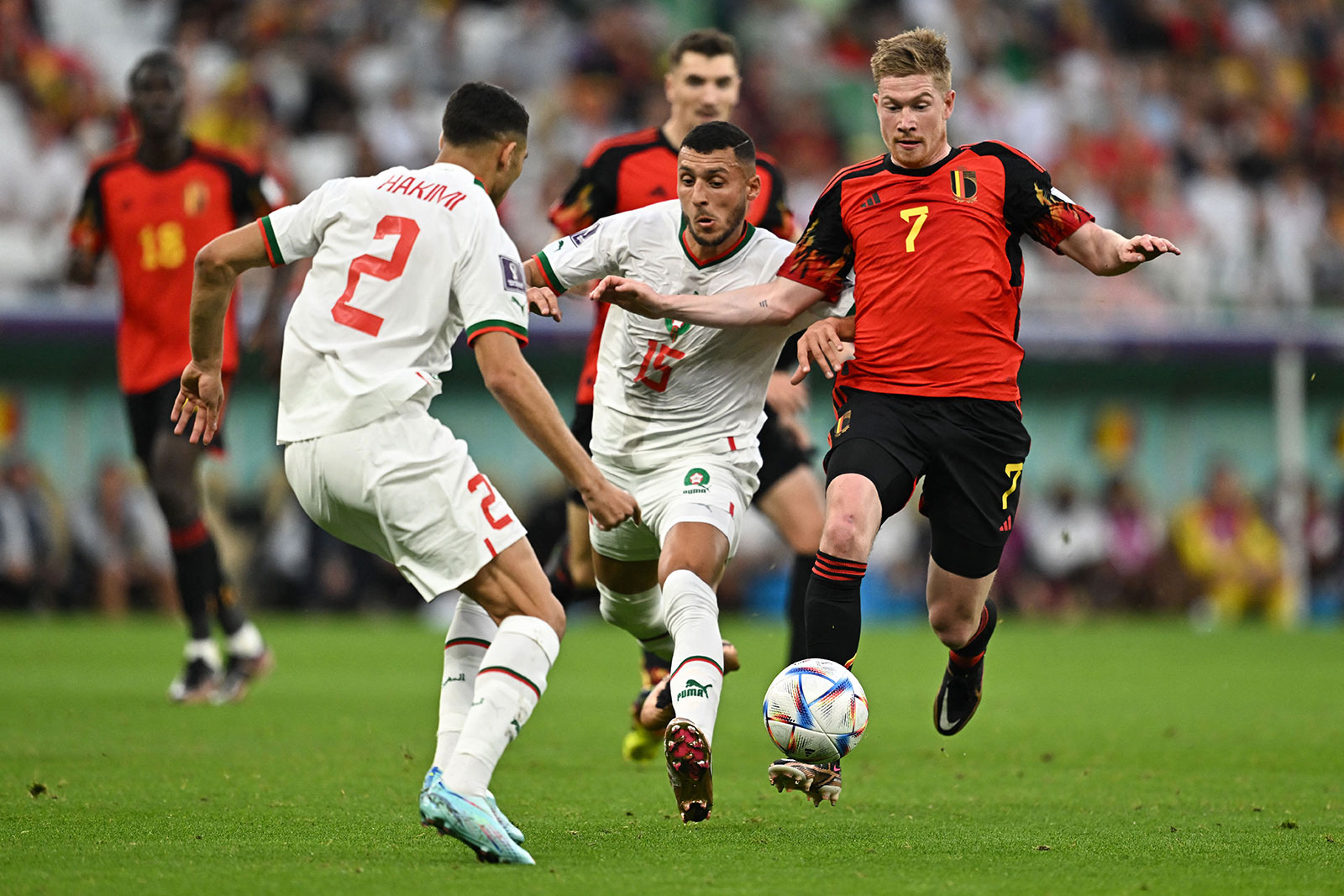Belgium's Kevin De Bruyne and Morocco's Selim Amallah fight for the ball during the first half of their match on November 27. 