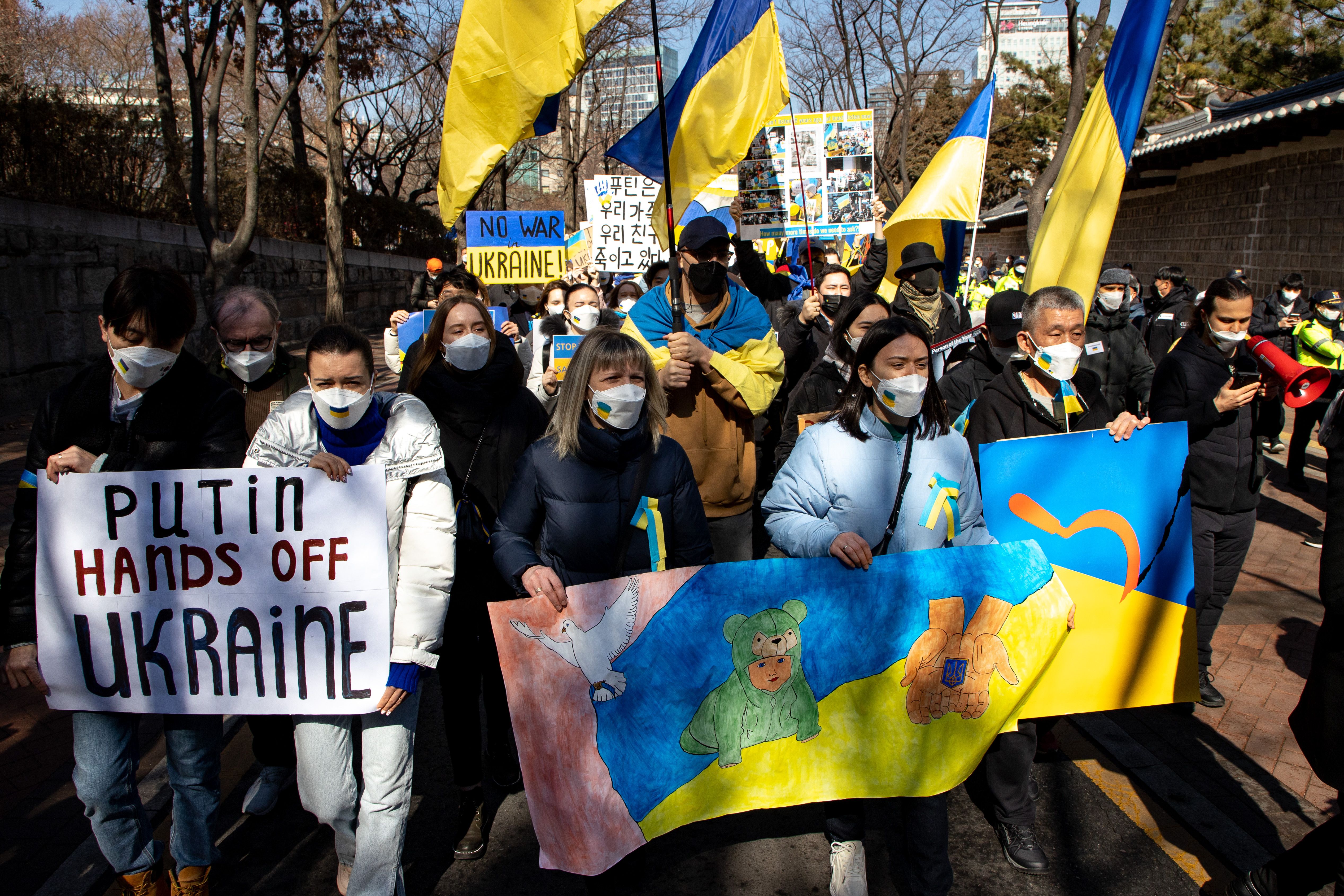People gather in protest against Russia's invasion of Ukraine outside of the Russian Embassy in Seoul, South Korea, on February 27. 