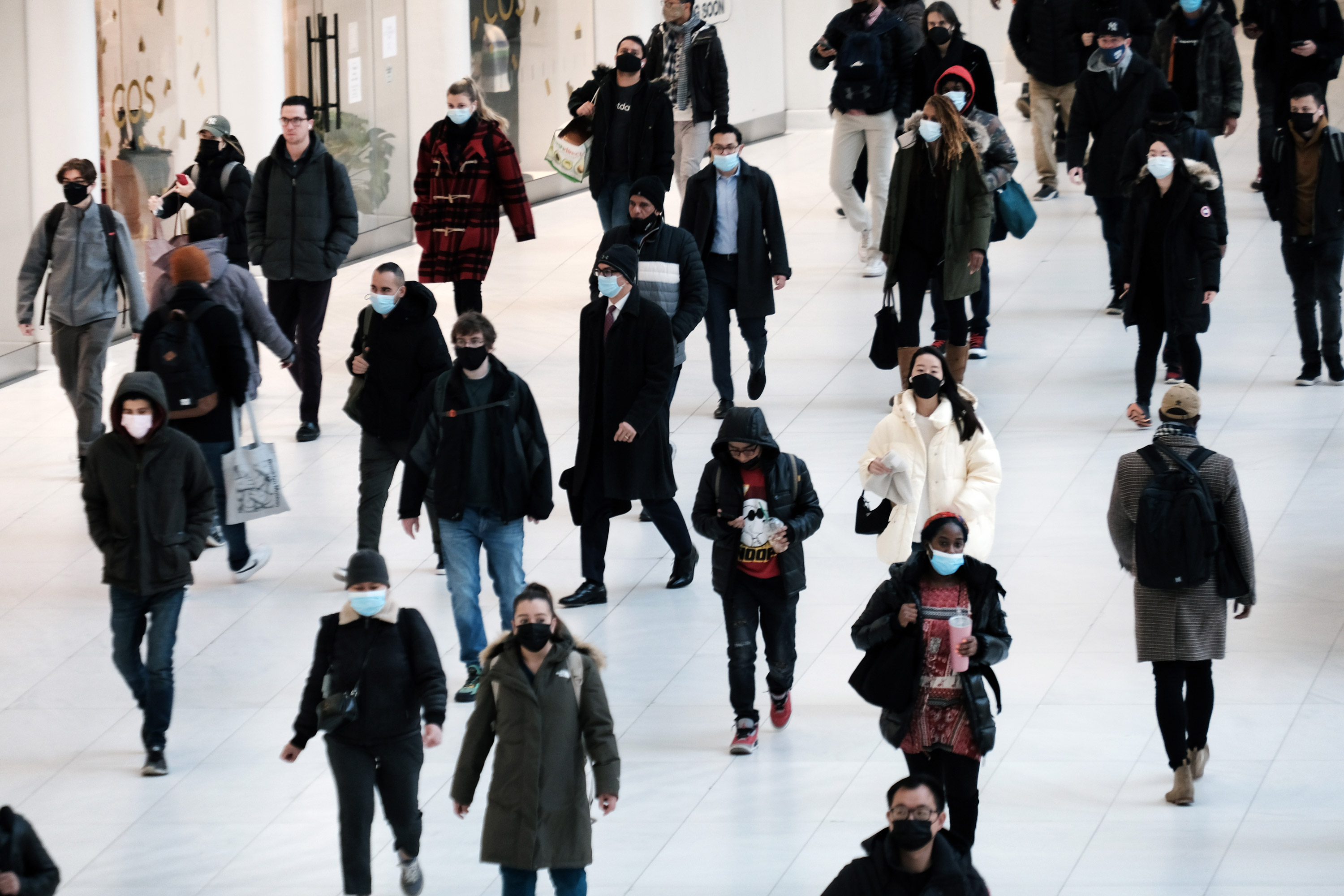 People wear masks at an indoor mall in The Oculus on December 13, in New York City. 
