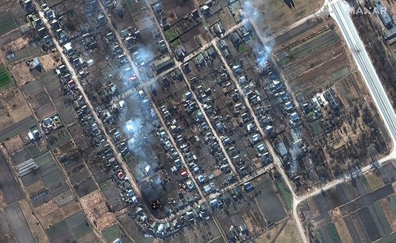 Homes on fire in the village of Rivnopillya.