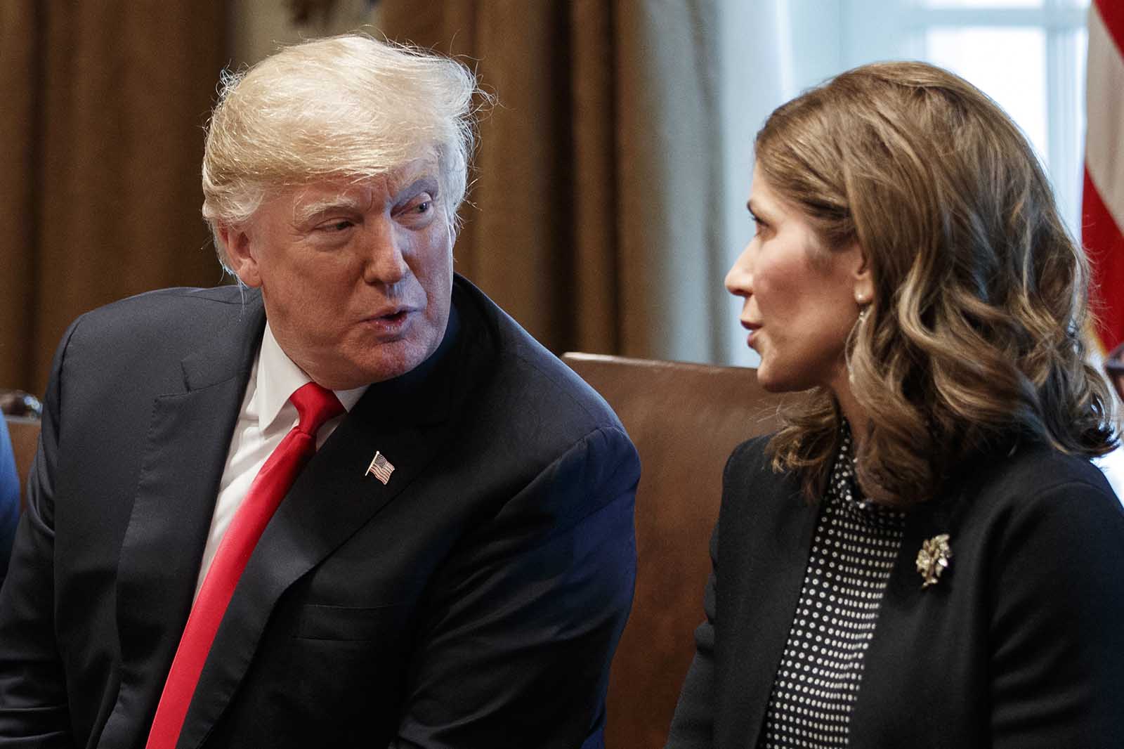 In this Dec. 12, 2018 file photo, President Donald Trump speaks to then-Gov.-elect Kristi Noem, during a meeting at White House in Washington.