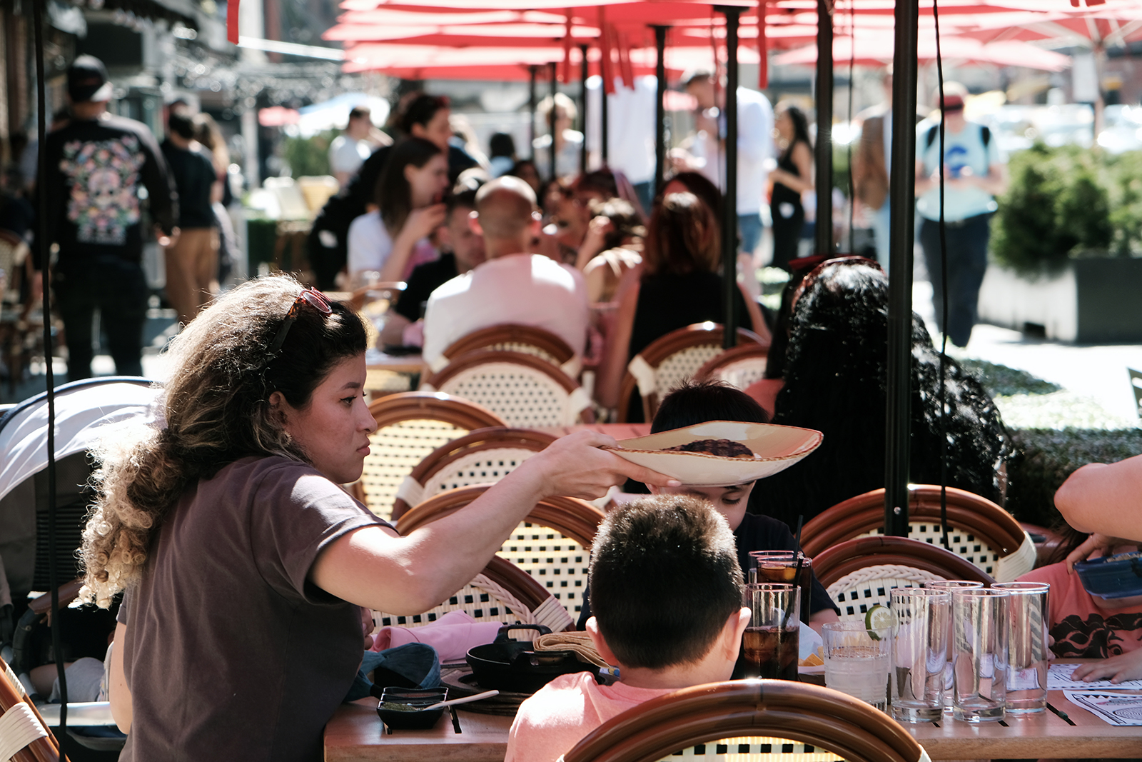 People eat at an outdoor restaurant in Manhattan on April 12 in New York City. 