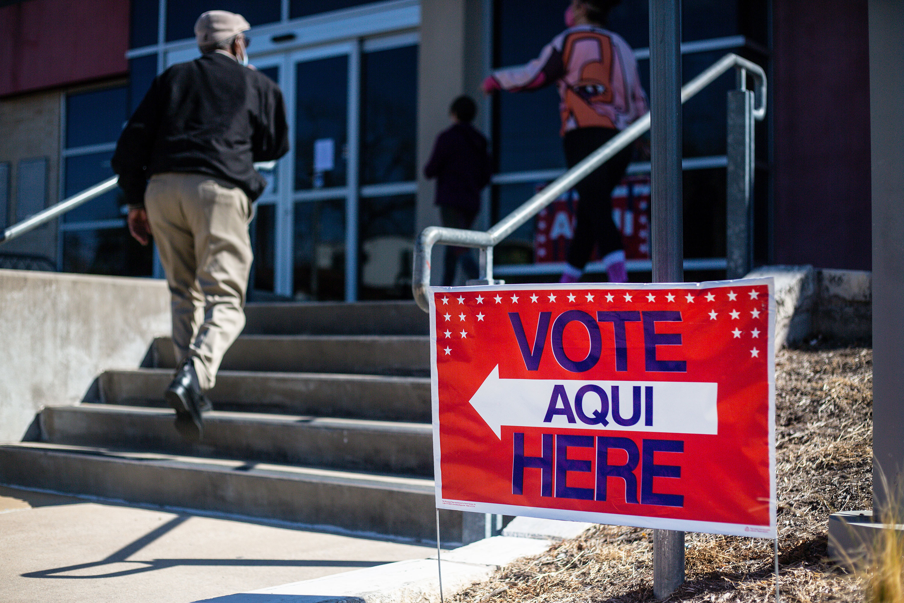 People arrive at a voting center in Austin, Texas, on March 1.