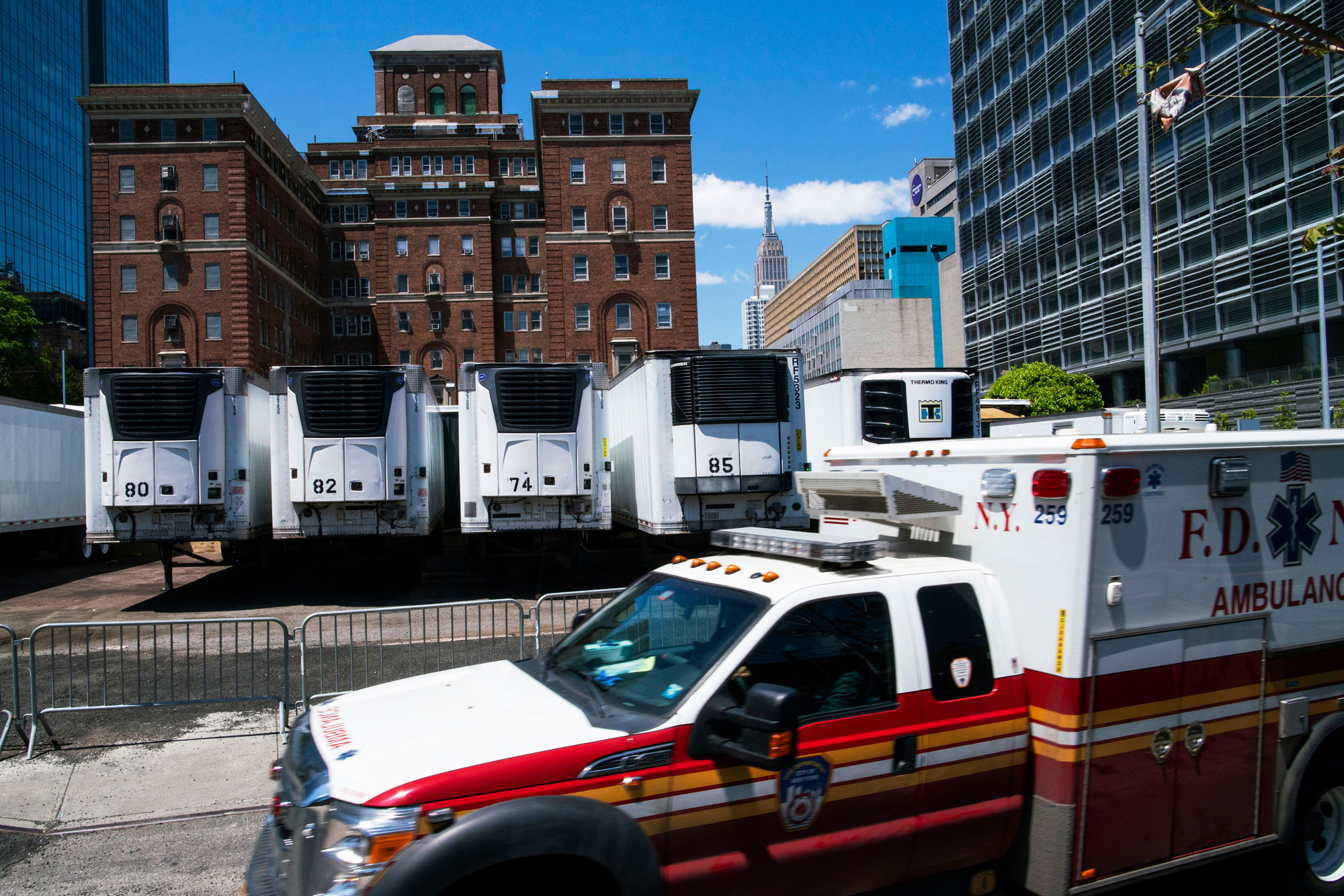 Trucks used as temporary morgues are seen outside the New York City Chief Medical Examiner's office on May 12 in New York City. 