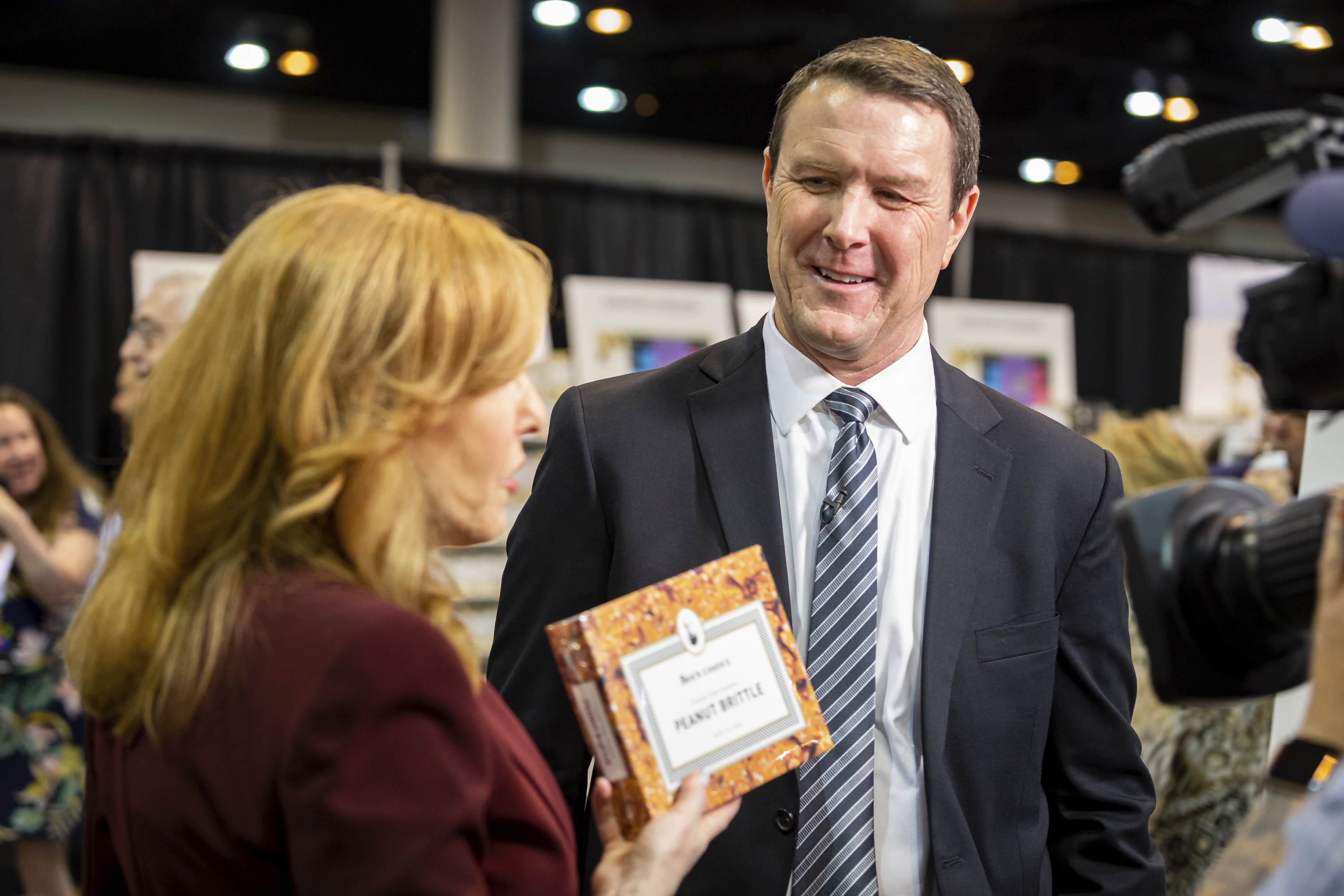 See's Candies President and CEO Pat Egan, speaks to Fox Business reporter Liz Claman about Warren Buffett's favorite See's product, Peanut Brittle, during the Berkshire Hathaway shareholders meeting, on Friday, April 29.
