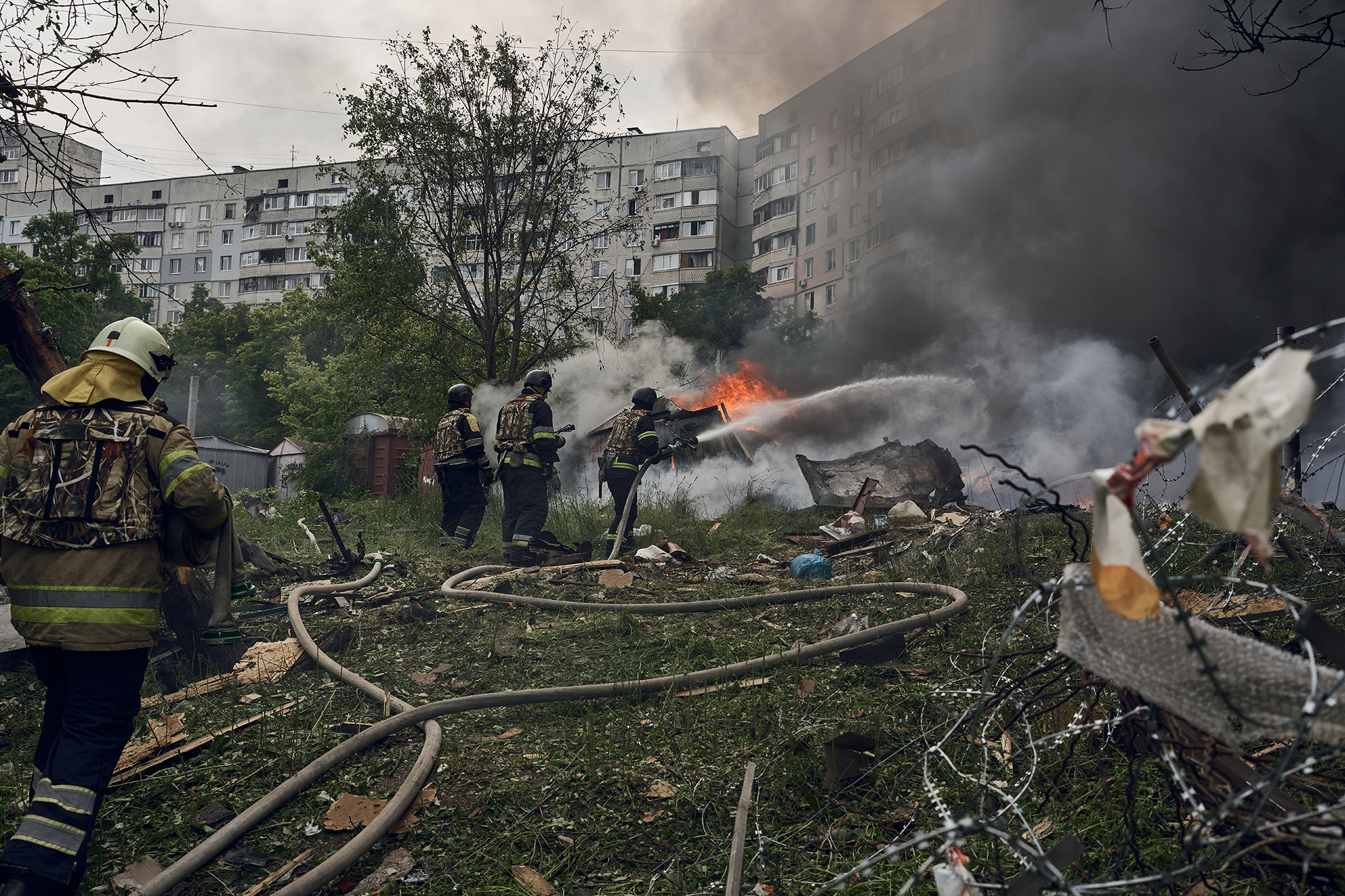 Emergency services fight a fire following a Russian air strike on May 14, near Kharkiv, Ukraine.